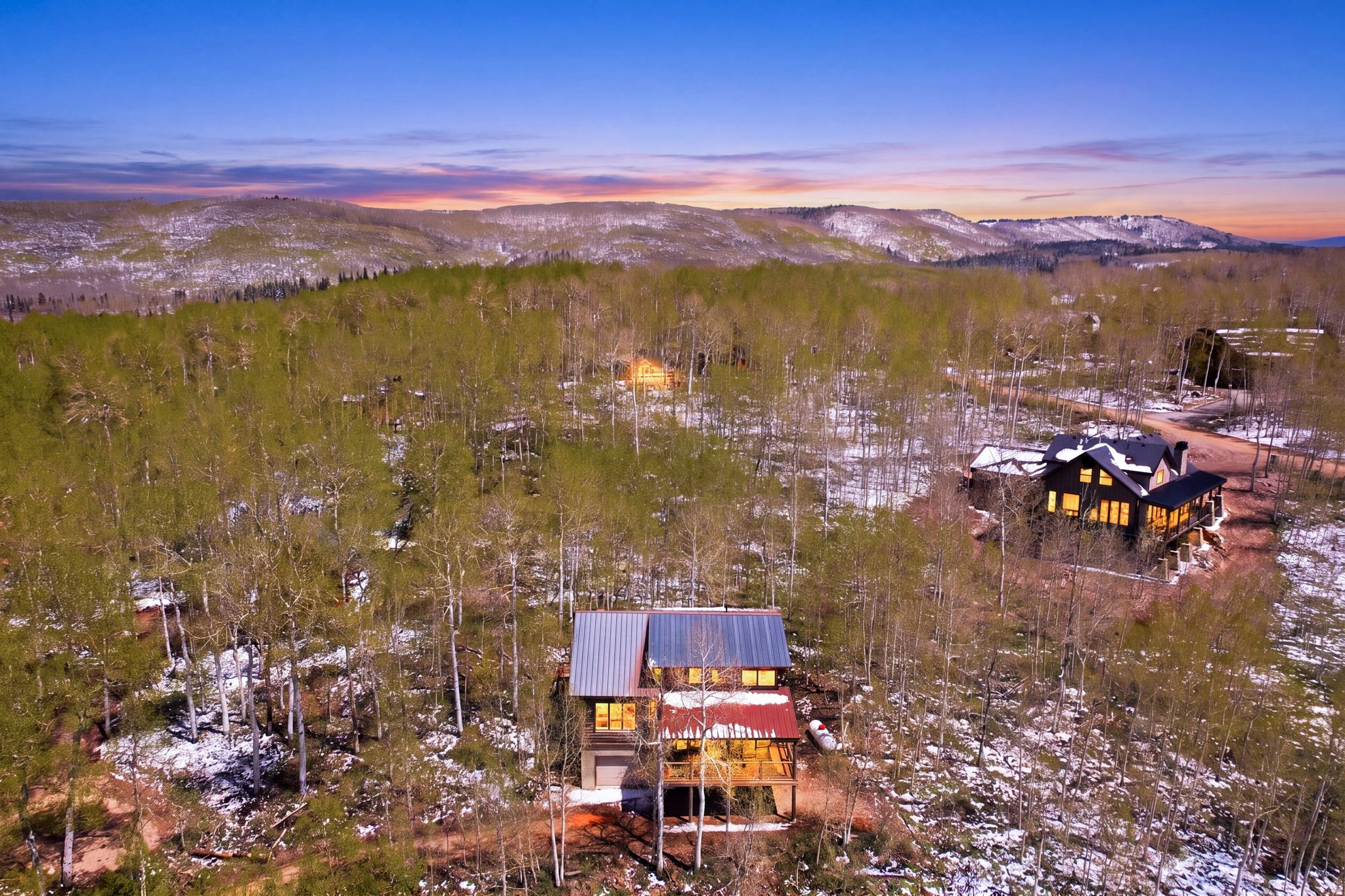 Exceptional mountain retreat and value opportunity in Timber Lakes Estates! This beautifully maintained 1991 log cabin offers 3 bedrooms, 2 full bathrooms, and a desirable main-level primary suite, all set on a private and usable 0.57-acre lot surrounded by towering aspens and mountain serenity. Recently re-stained and thoughtfully updated with new light fixtures and a stunning new Trex deck with decorative hog-wire railing and gas BBQ line, creating the perfect setting for relaxing or entertaining in the fresh mountain air. Approximately 900 sq ft of unfinished lower-level garage/shop space offers outstanding potential for a one-car garage, workshop, expanded recreation area, or future living space with added equity upside. Located within a private guard-gated mountain community just 7 miles east of Heber City with direct access to thousands of acres of national forest and endless year-round recreation including ATV riding, hiking, snowmobiling, skiing, golfing, boating, fishing, and more. Just 30 minutes to Park City and approximately one hour to Salt Lake City or Provo.