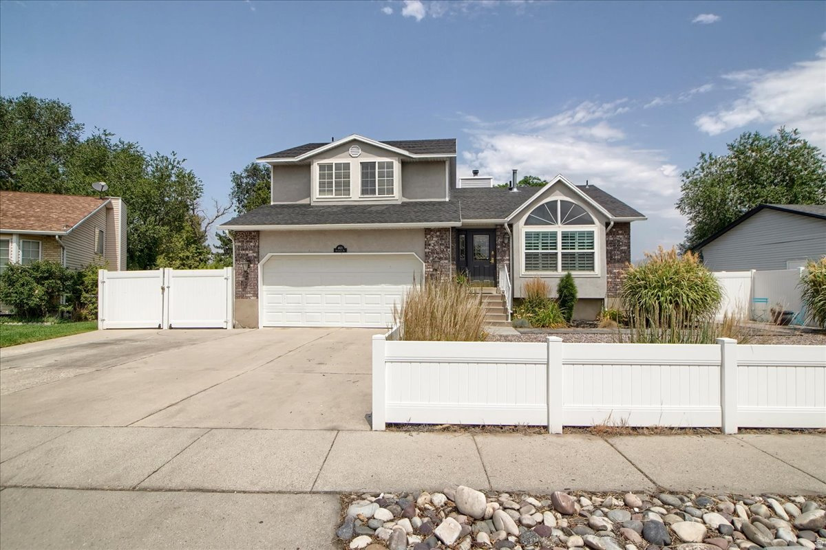 Updated 2 story home with full basement. Tucked back off busy streets in a quiet neighborhood. 2017 updated items are: new roof, carpet, flooring, tile, 3 new bathrooms, kitchen with island, paint, furnace, a/c, water heater, patio, quartz countertops, neutral paint colors. Plumbing fully replaced in 2024. Lots of natural light. Family room and laundry off kitchen with fireplace. No backyard neighbors. Covered patio, spacious RV parking and fully fenced. Tastefully arranged xeriscaping with raised garden beds. West-facing home so you can enjoy that evening shade on the back patio. Walking distance to Valley Regional Park, Recreation center, library, swimming pool and golf.  Easy commuting on Bangerter or Hwy 215. Square footage figures are provided as a courtesy estimate only and were obtained from county records. Buyer is advised to obtain an independent measurement.