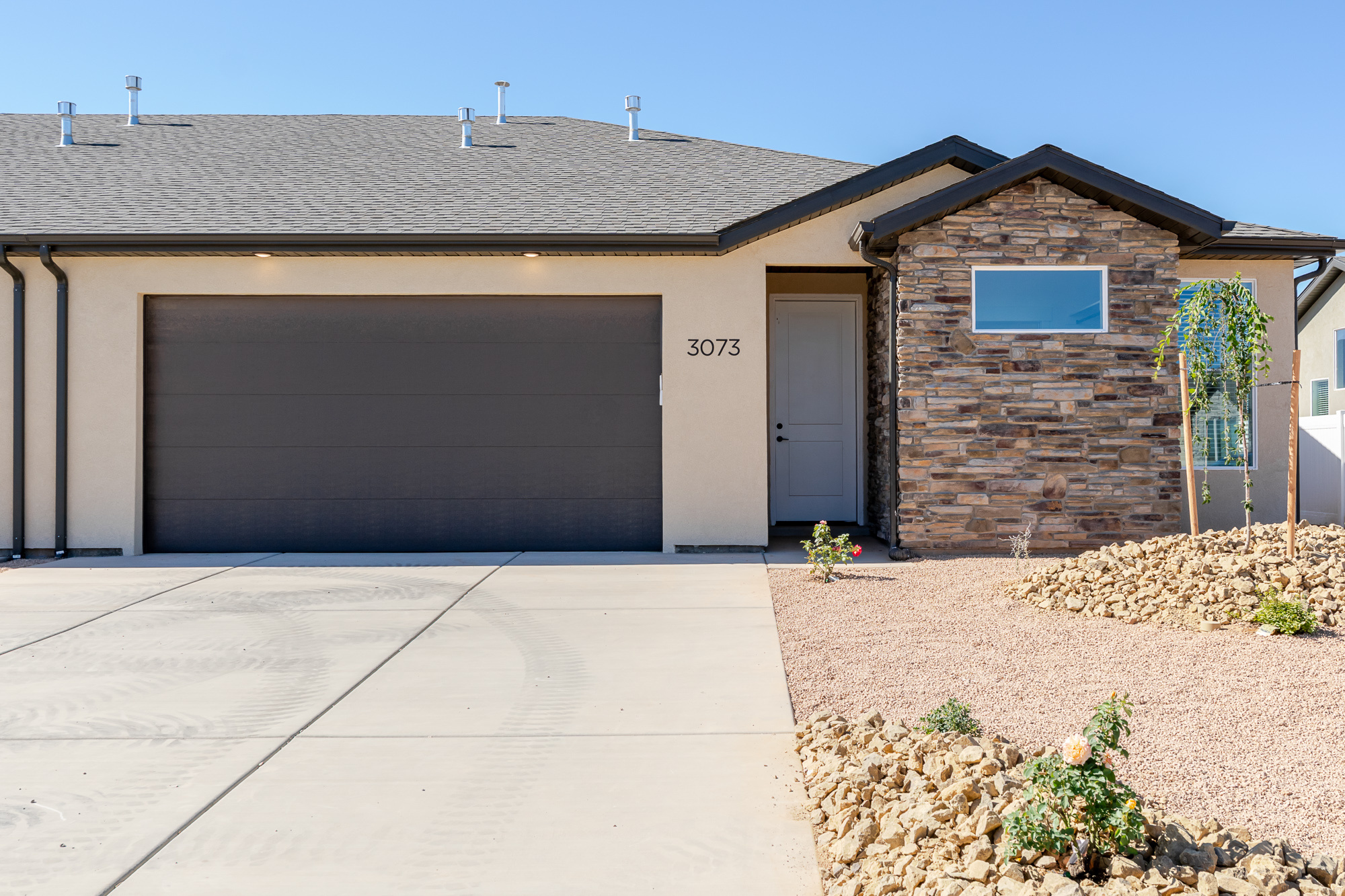 Brand-new 3 bedroom, 2 bathroom twin homes with a spacious 2-car garage. Each home features custom cabinetry, granite countertops, GE appliances, a walk-in pantry, 9-foot ceilings in the bedrooms, and a stunning 12-foot vaulted ceiling in the main living area. Enjoy a fully fenced backyard and included front yard landscaping for a move-in ready experience. Located in the highly desirable EKKO View Estates, this exciting new subdivision offers exclusive access to a private clubhouse with an indoor pickleball court, playground, and a dog park coming in phases 3 and 4. Five stylish floorplans with upgrade options, full-size city streets, and a private community park, EKKO View Estates is where luxury meets lifestyle.