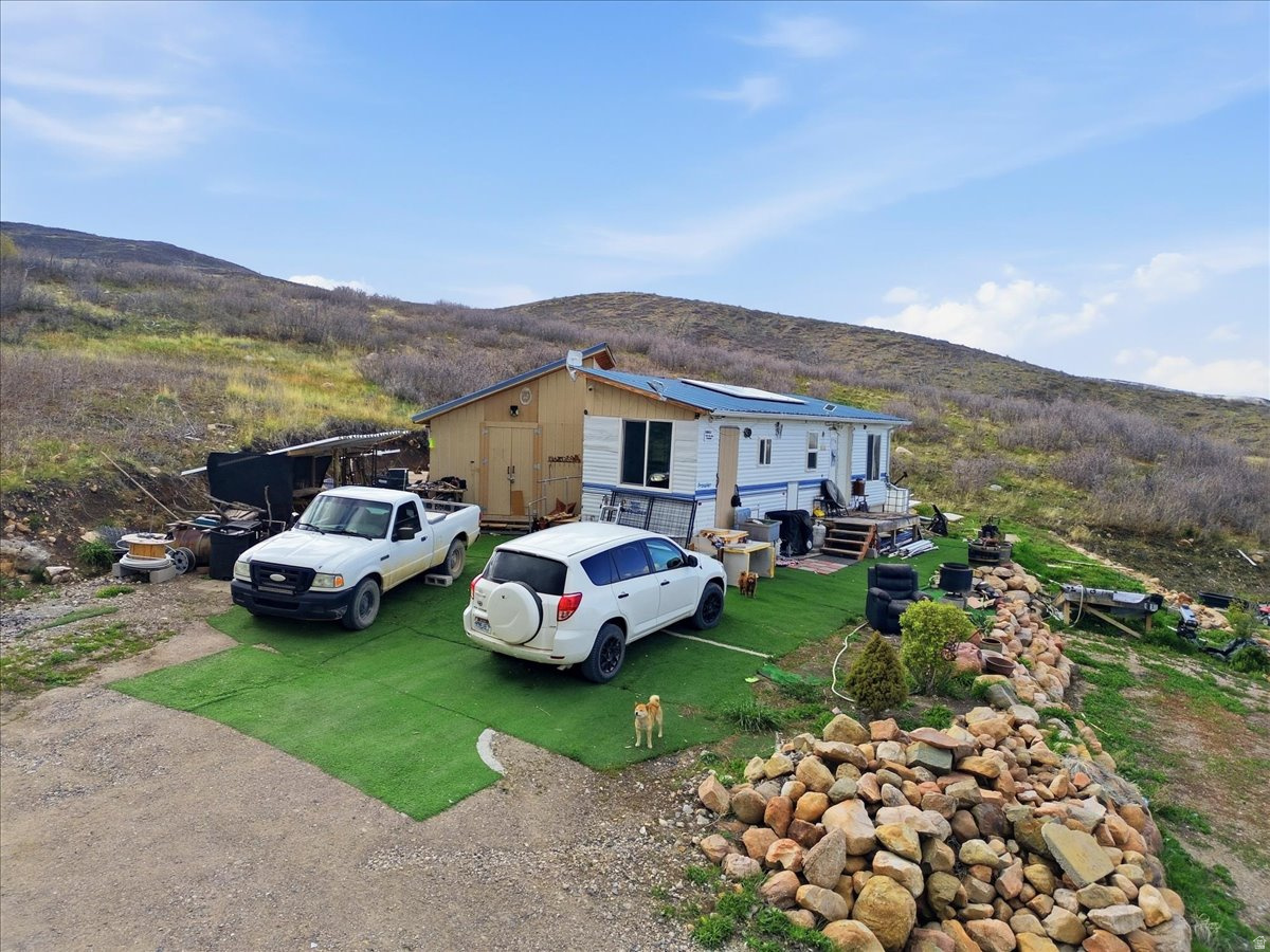 Escape to your own private retreat with this versatile property featuring a 1996 Prowler-perfect as a recreational getaway or a full-time residence! Located in the desirable Indian Ridge area, this property is already equipped with water and a septic system, making it ready for immediate use. Enjoy direct access to nearby trails, ideal for ATV, UTV, and horseback riding adventures, or take in the breathtaking scenery along Skyline Drive just minutes away. After a day outdoors, cozy up by the fireplace and unwind in comfort. The property offers charming landscaping with a maintained lawn and mature trees, creating a peaceful setting. Additional features include a wood shed for storing firewood and a separate work shed-perfect for tools, gear, or extra storage. Whether you're looking for a summer escape or a place to call home year-round, this property offers the perfect balance of seclusion and convenience-just 3540 minutes from town. Come experience the beauty and adventure that awaits!  Buyer is advised to obtain an independent measurement.