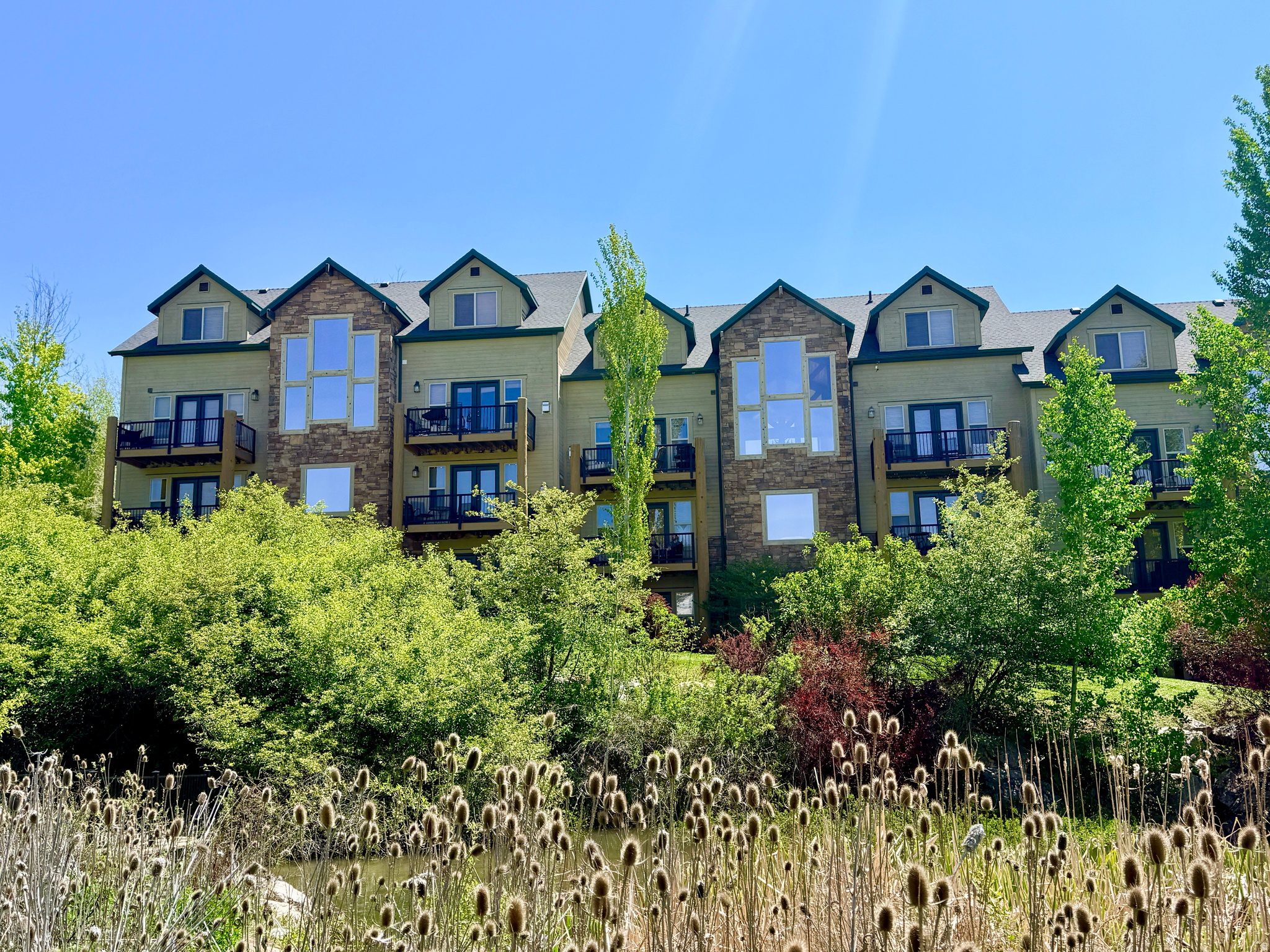 MOTIVATED SELLER!  Zoned for nightly rentals.  This beautiful, mountain rustic, 3-bedroom deluxe condo is located at the end of a cul-de-sac and offers breath-taking views of Ben Lomond and James Peak. One of the most popular floor plans at Moose Hollow due to the large kitchen/gathering room on the main floor. Very peaceful and secluded back patio and deck which are adjacent to the year-round stream and pond. Walk-out basement from the Master bedroom provides easy access to the lower patio. All furnishings in condo are included, turn-key and ready for use as a full-time residence or second home rental investment property. Moose Hollow is only minutes from Wolf Creek Resort 18-hole Golf Course, 5 miles from Powder Mountain Ski Resort and only 15 miles from Snowbasin Ski Resort. Enjoy miles of hiking and biking trails, boating, paddleboarding and fishing on Pineview Reservoir and so much more for those who love the outdoors!