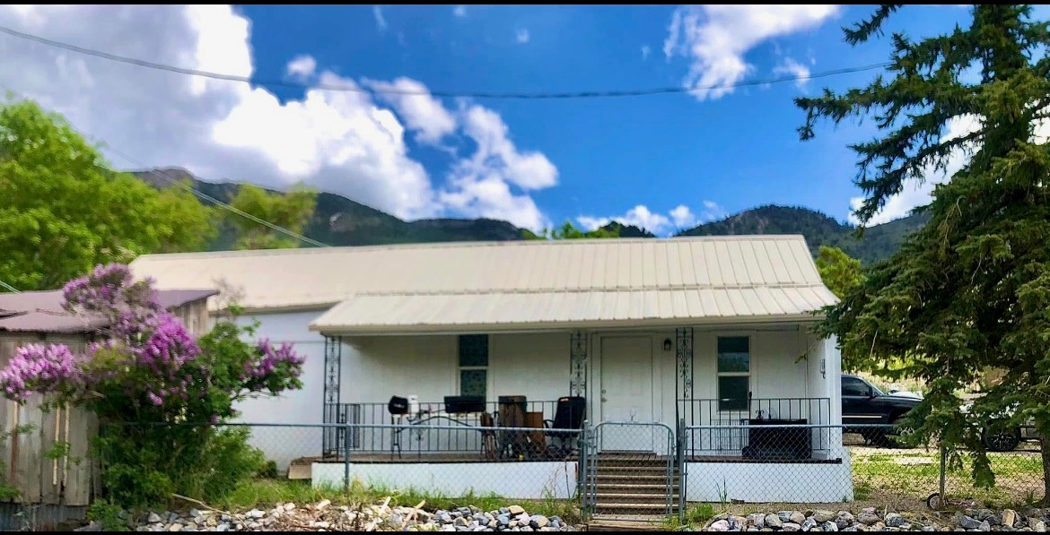 Ditch the city noise & settle into this cottage offers a single-level ranch layout with 3 bedrooms, 2 bathrooms, and modern comforts like central air, a built-in dishwasher, and a freestanding range/oven. Situated on a 0.11-acre lot with mature trees, the property features peaceful mountain and valley views from an open porch and includes practical elements like a durable metal roof, central gas heating, and connected public utilities. You can enjoy the quiet of this remote mountain town while remaining only 4050 minutes from the amenities of either Provo or Lehi. Founded in 1870, Eureka was the Gem of the Tintic Mining District and once ranked among the wealthiest cities in the nation per capita. The entire town is now a designated National Historic District, preserving its rugged charm and the legendary Eureka spirit from its silver boom days. This home sits right in the heart of that storied American West heritage.