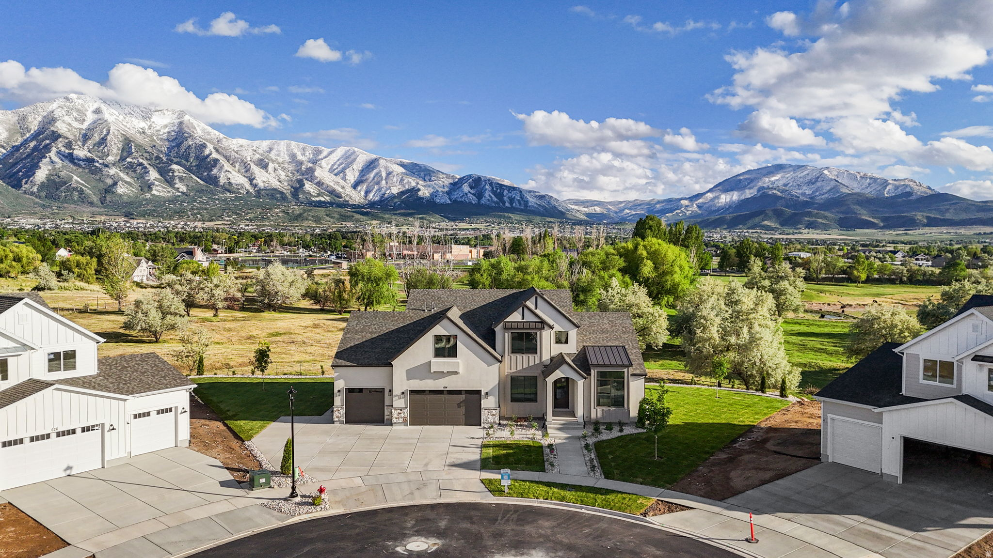2026 Utah Valley Parade Home in Davis Farms | The Bentley by Revere Homes.  Where modern design meets everyday comfort in beautiful Davis Farms, one of Utah Valley's premier communities.  Introducing The Bentley by Revere Homes, a featured 2026 Utah Valley Parade Home in a highly sought after, family friendly neighborhood.  This Modern Tudor offers luxury finishes and thoughtful design throughout.  The home features a stunning kitchen with under cabinet lighting, high end finishes, and a layout built for gathering and entertaining. Bright, open living spaces, a statement fireplace, and abundant natural light create a warm, inviting feel.  The spacious primary suite includes a freestanding soaking tub and a design focused on comfort and relaxation. Iron railing, black hardware, and modern finishes carry a cohesive style throughout.  Fully finished ADU with private garage access. Enjoy full landscaping and direct access to the Grimes Pond Trail System.  This is a rare opportunity to own a Parade Home in Utah Valley, combining modern farmhouse style, luxury living, and a premier Davis Farms Salem, Utah Location!