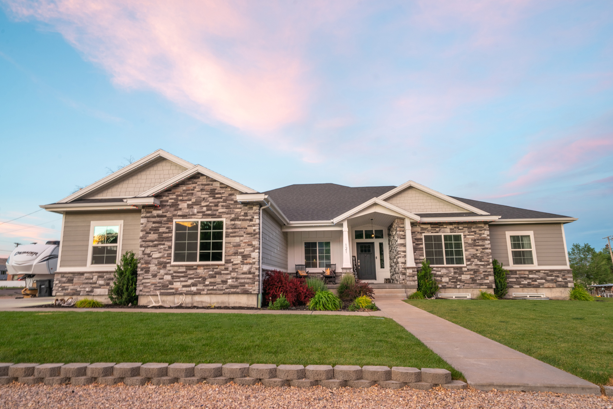 Experience the perfect balance of space, comfort, and small-town charm in this exceptional home built in 2018 and situated on 0.97 acres in a peaceful, picturesque community. Offering 5,177 sq. ft. of living space, this stunning property features 7 bedrooms, 3.5 bathrooms, two spacious family rooms, a formal living room, and a basement kitchenette, providing flexibility for entertaining, guests, or multi-generational living. The beautifully designed interior showcases vaulted ceilings, two cozy fireplaces, and an open, inviting floor plan filled with natural light. Large closets, offering abundant storage and convenience throughout the home. The fully finished basement adds valuable living space and functionality, making it ideal for a variety of lifestyles. Outside, you'll find a massive, oversized 1400 sqft garage, complete with a dedicated workshop area providing ample space for vehicles, hobbies, and storage. An included ADU/rental property offers excellent income-producing opportunities or additional accommodations for family and guests.  Approximately 950 Sq ft, not included in the 5177 sqft listed above. 2 bd, 1 bath. Could use a little TLC but the potential is huge with this!  With just about 1 acre of space, you'll have plenty of room outside to enjoy spending time with your loved ones, playing, gardening and watching the gorgeous sun sets across the valley.  Surrounded by the beauty and tranquility of small-town living, this exceptional property combines modern construction, abundant space, and incredible flexibility. Whether you're looking for room to grow, space to entertain, or the added benefit of rental income, this one-of-a-kind property is ready to welcome you home.  More photos coming soon!