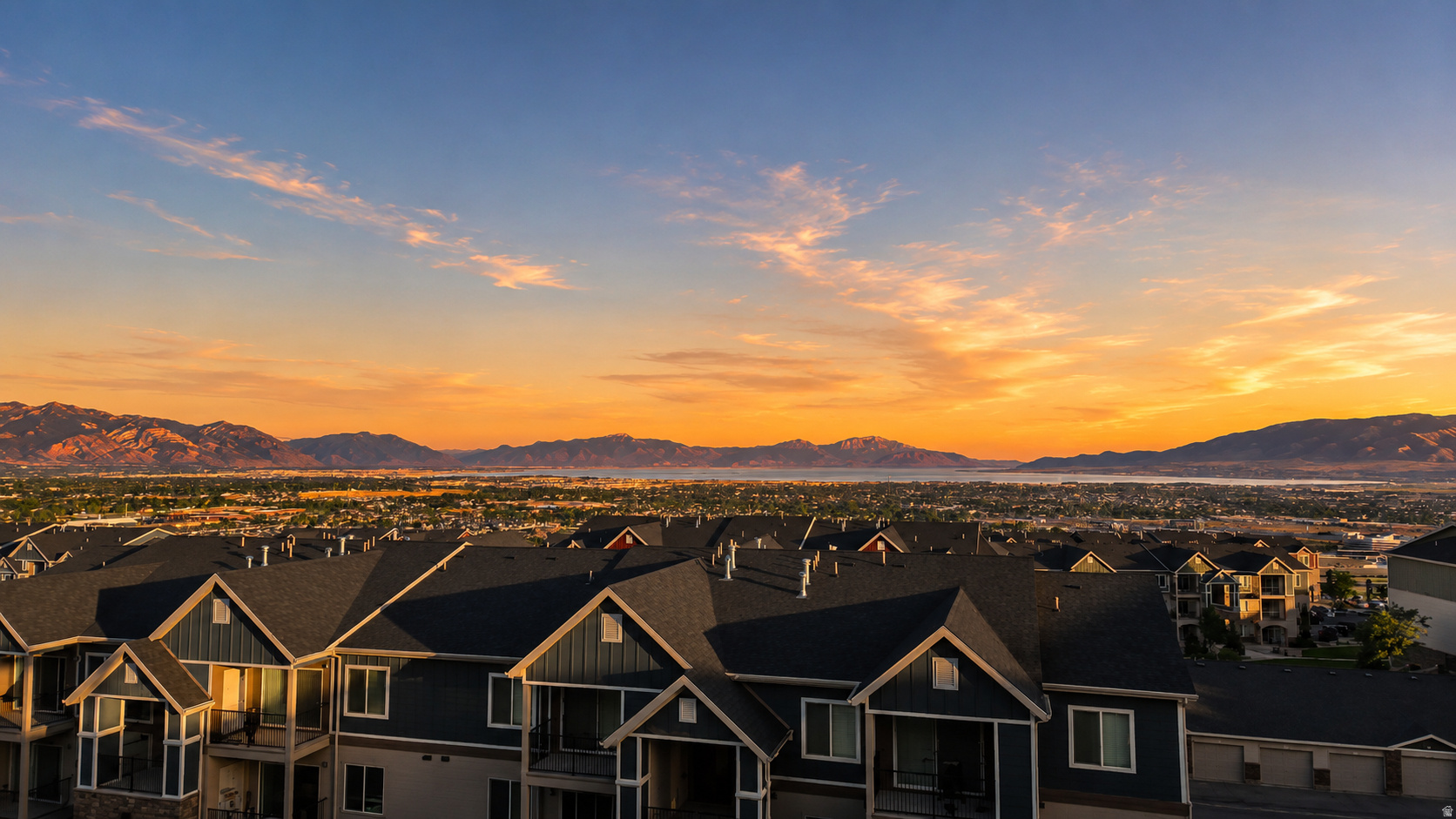 Perched high above the valley in one of Traverse Mountain's most coveted neighborhoods, this extraordinary residence offers more than a home-it offers a front-row seat to one of Utah's most spectacular landscapes. Imagine beginning each morning watching the sun rise over the Wasatch Mountains, spending your afternoons overlooking the heart of Silicon Slopes, and ending every evening with breathtaking sunsets stretching across Utah Lake from the comfort of your own deck. It's the kind of view that never gets old.  Designed for those who appreciate both luxury and functionality, this home seamlessly blends timeless architecture with modern comfort. Expansive windows fill the living spaces with natural light while perfectly framing the panoramic scenery that becomes part of everyday life. At the center of the home, a dramatic two-story fireplace anchors the open-concept great room, flowing effortlessly into a beautifully appointed chef's kitchen featuring custom cabinetry, premium finishes, and an oversized island designed for everything from intimate family dinners to unforgettable gatherings.  The thoughtfully designed floor plan offers exceptional flexibility for today's lifestyle. Two luxurious primary suites provide privacy and convenience, making the home ideal for executive professionals, multigenerational families, or long-term guests. The fully finished walkout ADU features its own private entrance, kitchen, living space, and bedrooms-creating endless possibilities for extended family, visiting guests, or independent living while maintaining comfort and privacy for everyone.  Outside, the elevated deck becomes an extension of the home, inviting you to entertain beneath glowing sunsets, enjoy quiet mornings with coffee overlooking the valley, or simply take in the peaceful beauty that surrounds you. Few homes combine this level of privacy, scenery, and everyday livability in such a sought-after location.  Located in the heart of Silicon Slopes, you'll enjoy quick access to world-class technology employers, Traverse Mountain shopping and dining, Thanksgiving Point, premier golf courses, hiking and biking trails, and convenient freeway access connecting you to Salt Lake City, Provo, and everything Utah County has to offer. Whether your career takes you across the valley or your weekends are spent exploring the outdoors, this location places you at the center of it all while feeling worlds away.  With approximately 7 bedrooms, 5 bathrooms, two primary suites, and a fully equipped walkout ADU, this home delivers a rare combination of luxury, flexibility, and lifestyle. Opportunities to own a property with this level of versatility, breathtaking views, and premier Traverse Mountain location are exceptionally rare.  This isn't simply a luxury home-it's the lifestyle you've been working toward.