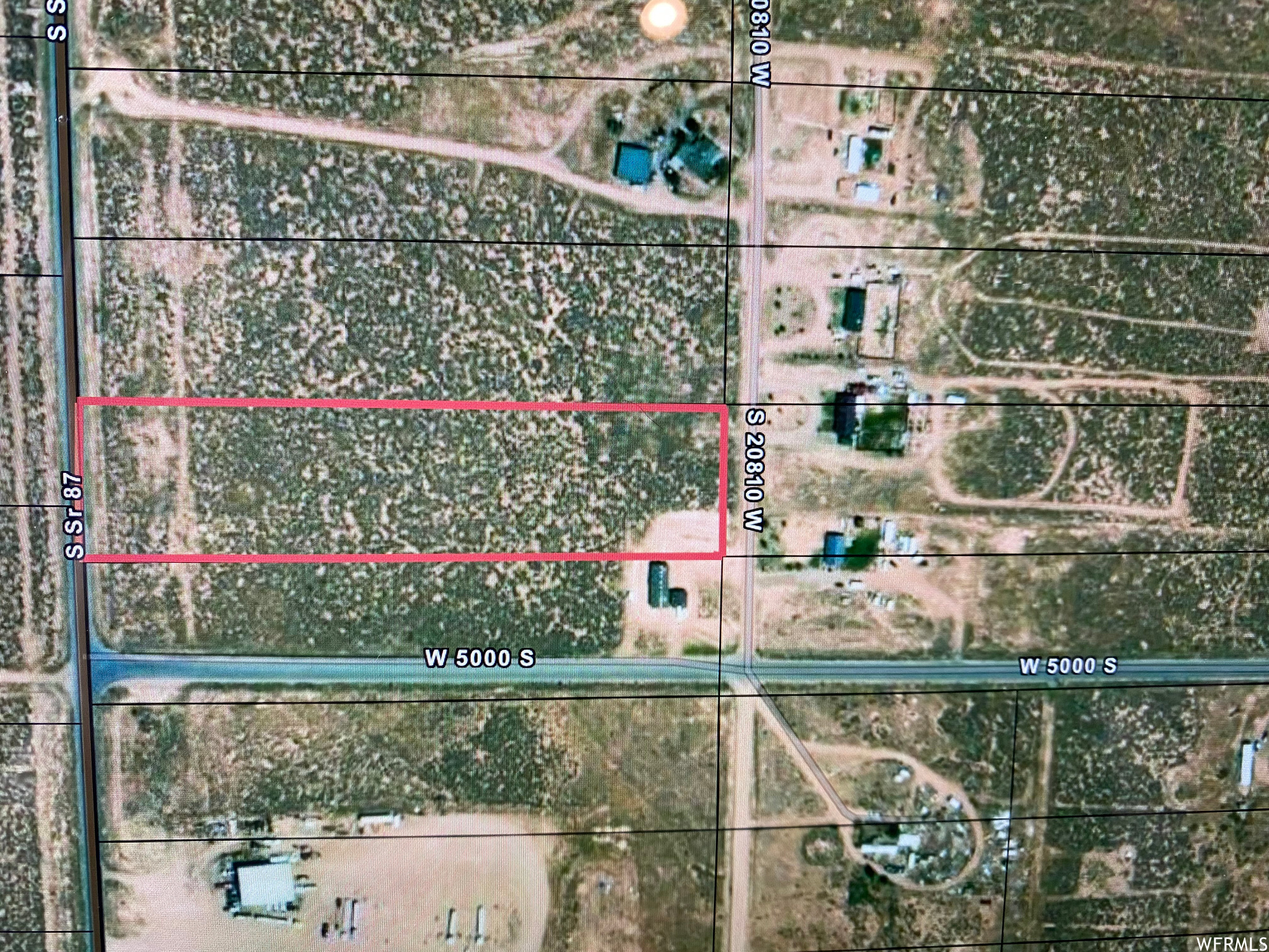 Build ready! 5.15 flat acres on highway 87!  Just north of 5000 south, east side of the road.  One culinary water hook up paid for, perc test done, and a power pole on the east side of the property! Easy to find and it is vacant!  Great for your home and/or business!  If you want an access from highway 87, you must speak with the State Roads Department.  Otherwise, the access is by county road on the east.  This is a high demand, low supply area!  Please call us today!