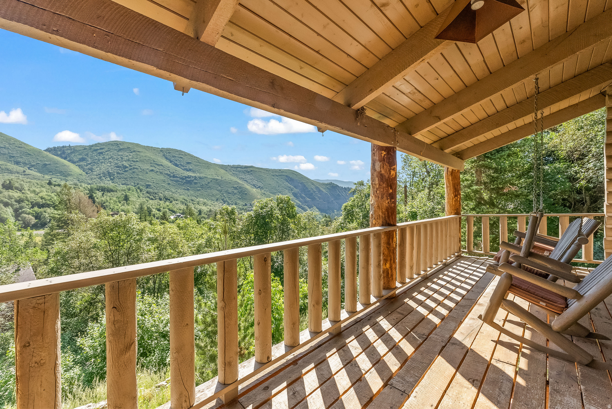 Set high above Sundance Canyon with expansive eastern views, this 4-bedroom home offers a detached guest studio, multiple outdoor living spaces, and easy access to Sundance Mountain Resort. A place designed for slow mornings, long evenings, and quality time spent in the mountains. Wood burning fireplace on the main level and vaulted ceilings. Home is being sold fully furnished. The added sunroom off the main bedroom can be an art studio or home office. A stunning guest suite with full bath, queen bed and loft w/ 3 singles was added above the detached 1 car garage (sq/ft for suite is referenced as level 4). The back patio is built into the hillside offering an ideal location for outdoor gatherings. More parking than you will ever need. Enjoy all that Sundance has to offer including hiking, skiing, and fishing the Provo River within minutes.