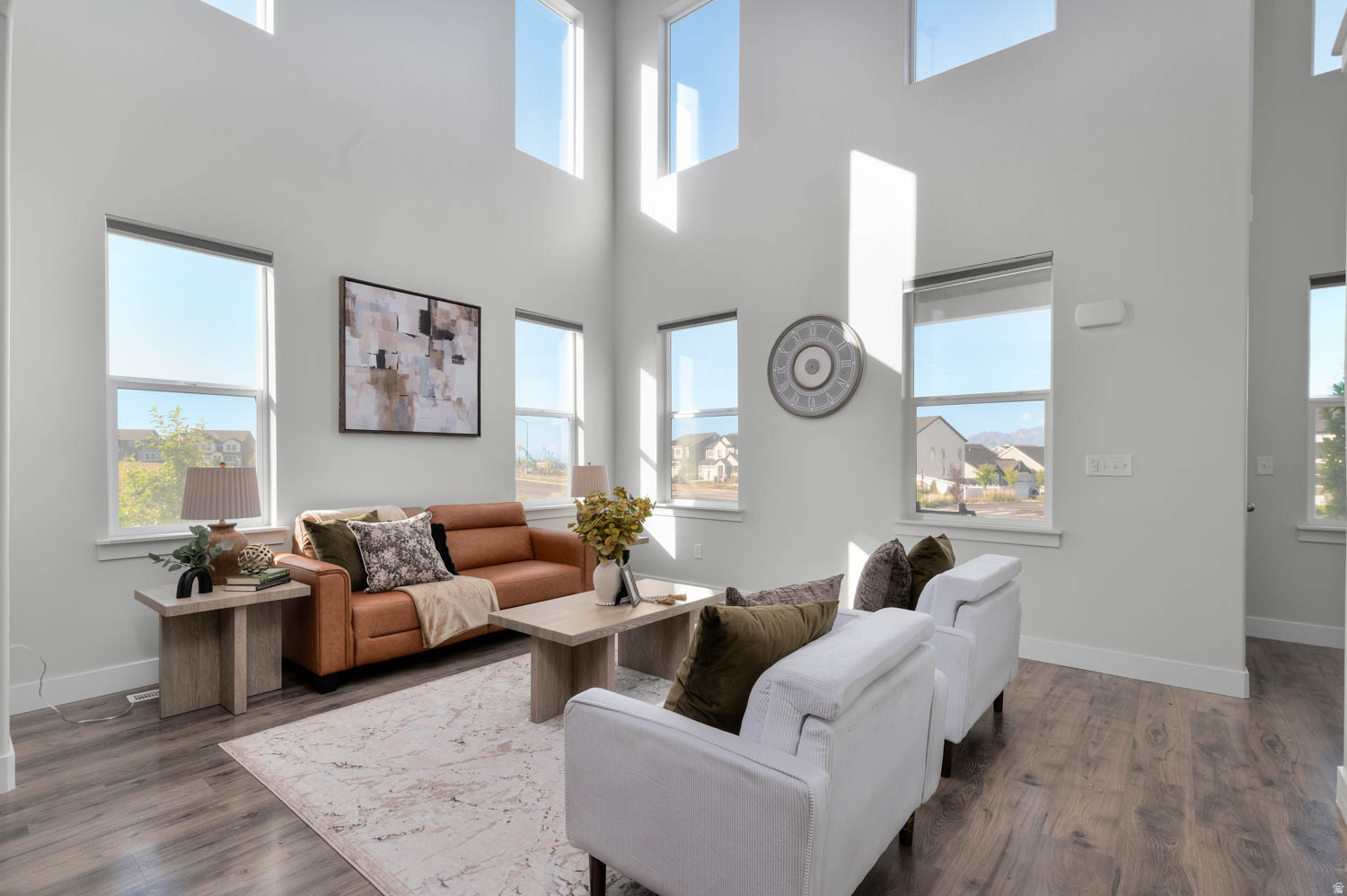 WELCOME HOME to the most coveted unit in all of Mountain Ridge! This stunning END UNIT townhouse with a HUGE SIDE YARD (owned and maintained by the HOA) is filled with windows galore and an abundance of natural light! Enjoy beautiful panoramic mountain views from your bright and airy living spaces, perfectly complemented by upgrades throughout including stainless steel Kitchen Aid appliances, a gas range, tankless water heater, electric and gas dryer hookups, and stylish cellular window shades in all bedrooms and ground-floor windows. The spacious primary suite offers a true retreat with a huge walk-in closet, additional custom shelving, and dual sinks in the en-suite bathroom. And with a large unfinished basement, there is more room to grow and customize your space! Ideally located within walking distance to the local elementary and high schools, and just minutes from shopping and dining, this home also includes access to fantastic HOA amenities, including Xfinity internet. Comfort, convenience, and quality come together in this exceptional property! Don't miss out! It won't last!