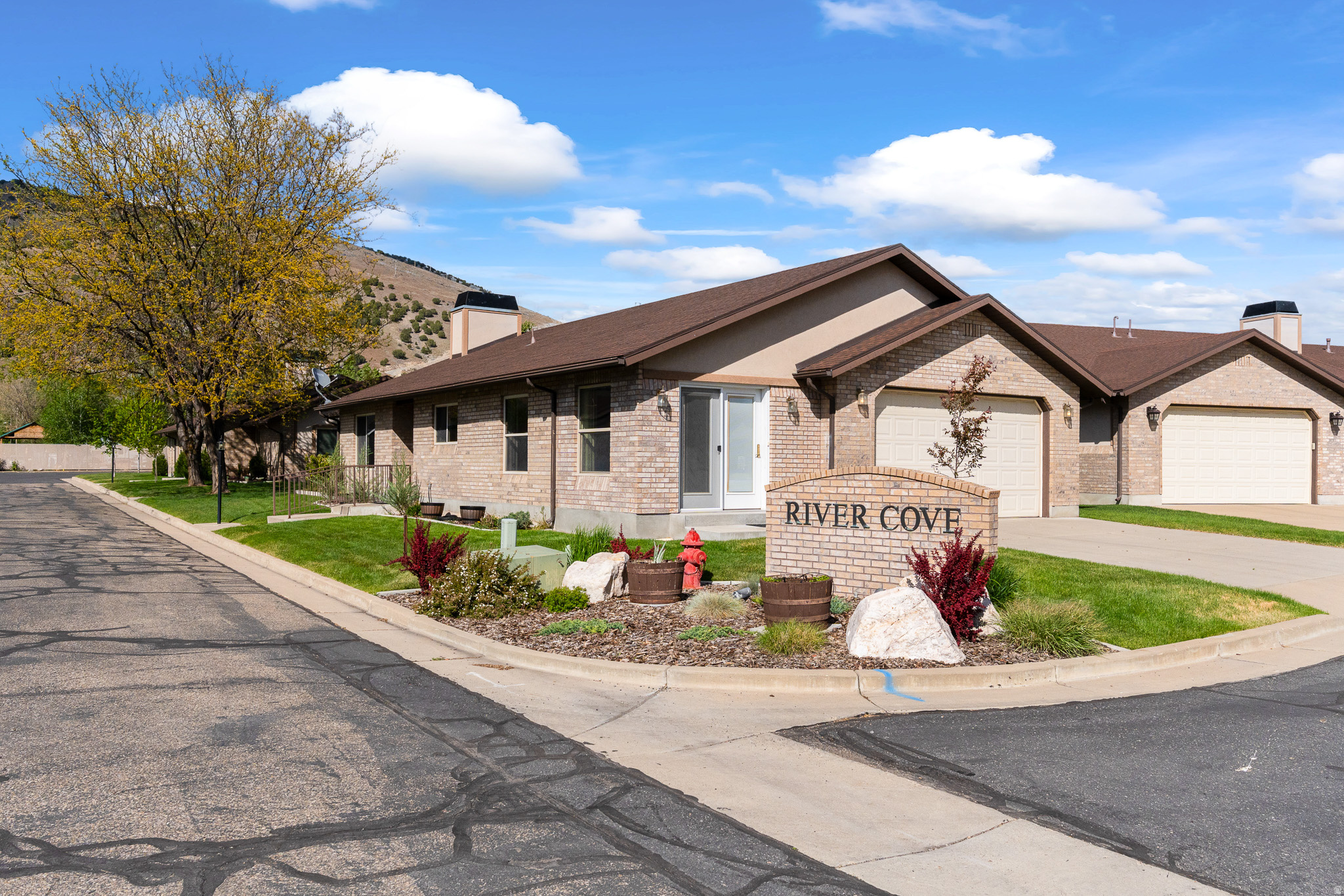 Rarely available in the highly sought-after River Cove community, this beautifully maintained one-level living retreat offers comfort, convenience, and pride of ownership throughout. Standalone units like this are hard to find and rarely come on the market, giving you added privacy. (Other units are side-by-side). Perfectly situated in the heart of Morgan, you'll enjoy being within walking distance to downtown shops, the grocery store, parks, restaurants, and even the local bowling alley. Inside, the home features vaulted ceilings, an open-concept layout, and an inviting kitchen with a spacious dining area and cozy sitting room-ideal for entertaining or everyday living. The thoughtfully designed floor plan includes a large walk-in pantry, dedicated laundry room, and two additional bedrooms with a full bath, perfect for guests, hobbies, or a home office. The spacious primary suite features vaulted ceilings along with a separate tub and shower for a relaxing retreat. Enjoy truly maintenance-free living with the HOA covering exterior maintenance, lawn care, and snow removal. Upgrades include a large center island, stainless steel appliances, luxury vinyl plank flooring, and plantation shutters. Immaculately cared for and move-in ready, this home is the perfect blend of style, comfort, and convenience.