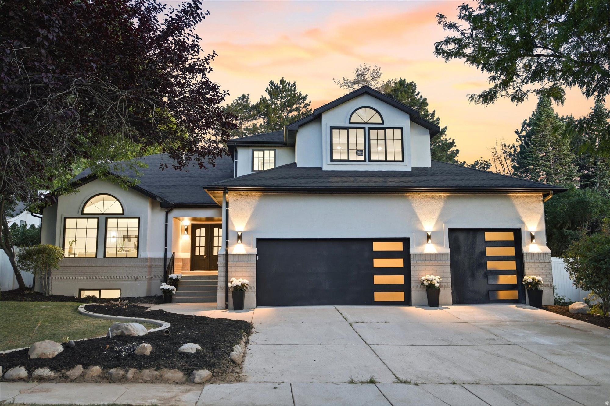 Nestled within the coveted Quail Meadow community, this nearly 4,800 sq. ft. luxury residence has been completely reimagined through an extensive high-end renovation where every detail was intentionally designed and expertly curated. Offering 5 bedrooms, 3.5 bathrooms, a 3-car garage with rare oversized height, and exceptional entertaining spaces throughout, this home delivers the scale, sophistication, and craftsmanship expected at the highest level.  A dramatic first impression unfolds the moment you enter. Soaring two-story ceilings span the grand entry, formal living room, formal dining room, and statement staircase, creating an immediate sense of openness and architectural presence rarely found in the area. Thoughtful designer finishes, elevated lighting, custom details, and intentional design elements carry throughout every inch of the home.  At the heart of the residence is a truly stunning chef's kitchen designed for both everyday luxury and entertaining. Quartzite countertops, custom cabinetry, a statement 48-inch professional gas range, and a striking stone-wrapped hood create a space that is as functional as it is beautiful. Seamlessly hidden behind custom cabinetry lies one of the home's standout features, a concealed butler's pantry offering additional prep, storage, and entertaining space.  The thoughtfully designed main floor offers formal and casual gathering spaces alike, including elegant formal living and dining rooms, a spacious breakfast area, a warm family room anchored by a fireplace, and an expansive laundry room.  Upstairs, the primary suite offers a true retreat experience. The spa-inspired bathroom features a freestanding soaking tub, oversized custom-tiled shower, and elevated designer finishes throughout. The oversized custom walk-in closet, complete with a center island and dedicated stackable washer and dryer hookup was designed with both luxury and convenience in mind. Two additional generously sized bedrooms and a full bathroom with custom tile complete the upper level.  The fully finished lower level expands the home's versatility with two additional bedrooms, a full bathroom, an expansive family room, and a full second kitchen, ideal for entertaining, extended guests, or multigenerational living.  Located on Millcreek's desirable east side with convenient access to world-class skiing, hiking, downtown Salt Lake City, dining, and recreation, this is a rare opportunity to own a fully transformed luxury residence where timeless design meets modern living.