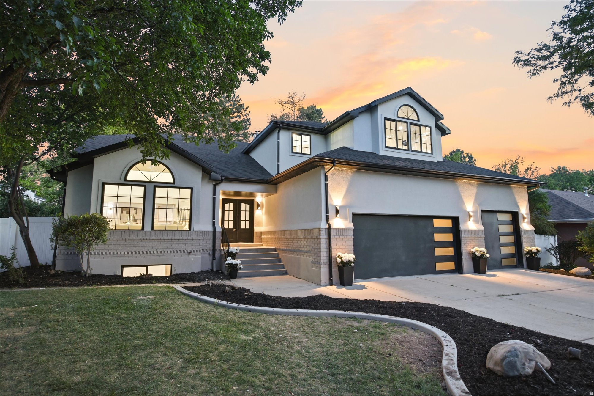 Nestled within the coveted Quail Meadow community, this nearly 4,800 sq. ft. luxury residence has been completely reimagined through an extensive high-end renovation where every detail was intentionally designed and expertly curated. Offering 5 bedrooms, 3.5 bathrooms, a 3-car garage with rare oversized height, and exceptional entertaining spaces throughout, this home delivers the scale, sophistication, and craftsmanship expected at the highest level.  A dramatic first impression unfolds the moment you enter. Soaring two-story ceilings span the grand entry, formal living room, formal dining room, and statement staircase, creating an immediate sense of openness and architectural presence rarely found in the area. Thoughtful designer finishes, elevated lighting, custom details, and intentional design elements carry throughout every inch of the home.  At the heart of the residence is a truly stunning chef's kitchen designed for both everyday luxury and entertaining. Quartzite countertops, custom cabinetry, a statement 48-inch professional gas range, and a striking stone-wrapped hood create a space that is as functional as it is beautiful. Seamlessly hidden behind custom cabinetry lies one of the home's standout features, a concealed butler's pantry offering additional prep, storage, and entertaining space.  The thoughtfully designed main floor offers formal and casual gathering spaces alike, including elegant formal living and dining rooms, a spacious breakfast area, a warm family room anchored by a fireplace, and an expansive laundry room.  Upstairs, the primary suite offers a true retreat experience. The spa-inspired bathroom features a freestanding soaking tub, oversized custom-tiled shower, and elevated designer finishes throughout. The oversized custom walk-in closet, complete with a center island and dedicated stackable washer and dryer hookup was designed with both luxury and convenience in mind. Two additional generously sized bedrooms and a full bathroom with custom tile complete the upper level.  The fully finished lower level expands the home's versatility with two additional bedrooms, a full bathroom, an expansive family room, and a full second kitchen, ideal for entertaining, extended guests, or multigenerational living.  Located on Millcreek's desirable east side with convenient access to world-class skiing, hiking, downtown Salt Lake City, dining, and recreation, this is a rare opportunity to own a fully transformed luxury residence where timeless design meets modern living.