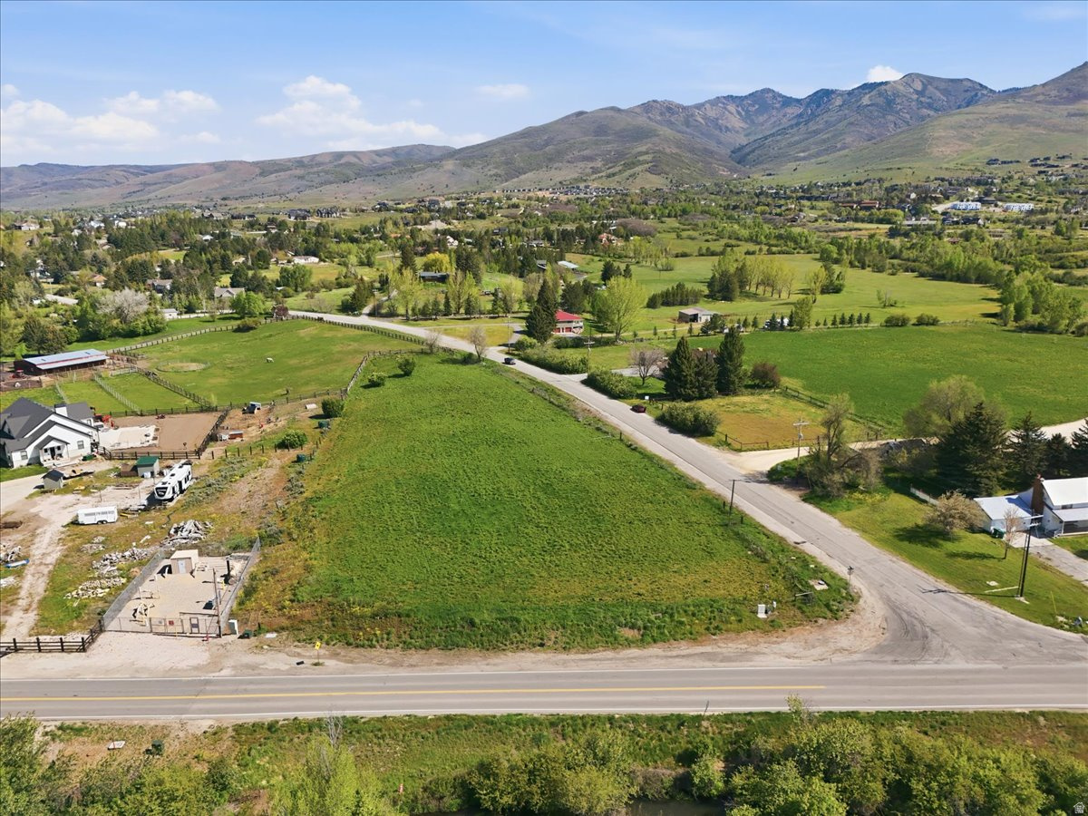 Rare 2.54-acre gem in beautiful Eden! This versatile lot is zoned for residential or agricultural use, making it the perfect site for your custom dream home (or two;) and horse property. Enjoy unparalleled access to world-class recreation, located just a short drive to Nordic Valley, Snowbasin, and Powder Mountain, As well as Pine View reservior. Plenty of space, fresh mountain air, and endless possibilities. Your slice of the Ogden Valley is calling! Property has previously passed a perc test for a sceptic field. Lot includes 1 share of Wolf Creek Irrigation secondary water. President of Irrigation Co. has valued 1  recent shares sold at $45k. Property facts are provided as a courtesy; Buyer to verify all information.