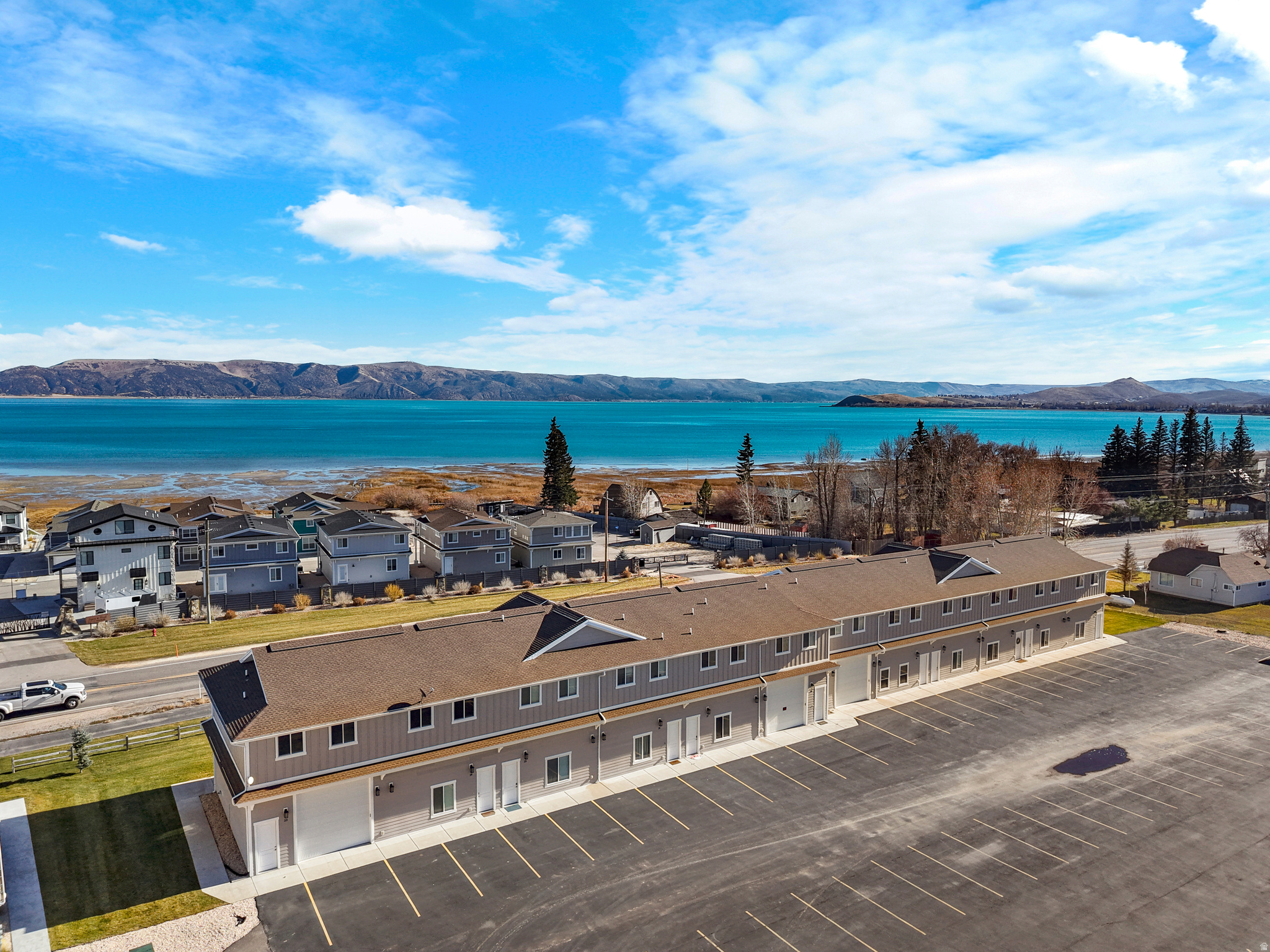 Fully furnished and turnkey townhome in the heart of all the fun at Bear Lake! Only steps away from the resort's private beach, two swimming pools, pickleball, hot tub, and clubhouse. Enjoy this popular and walkable vacation hub where restaurants, parks, shops, and beaches are close by. Plenty of parking for your guests and your boat trailer. Fantastic vacation destination with the option to offset your investment with rental income.
