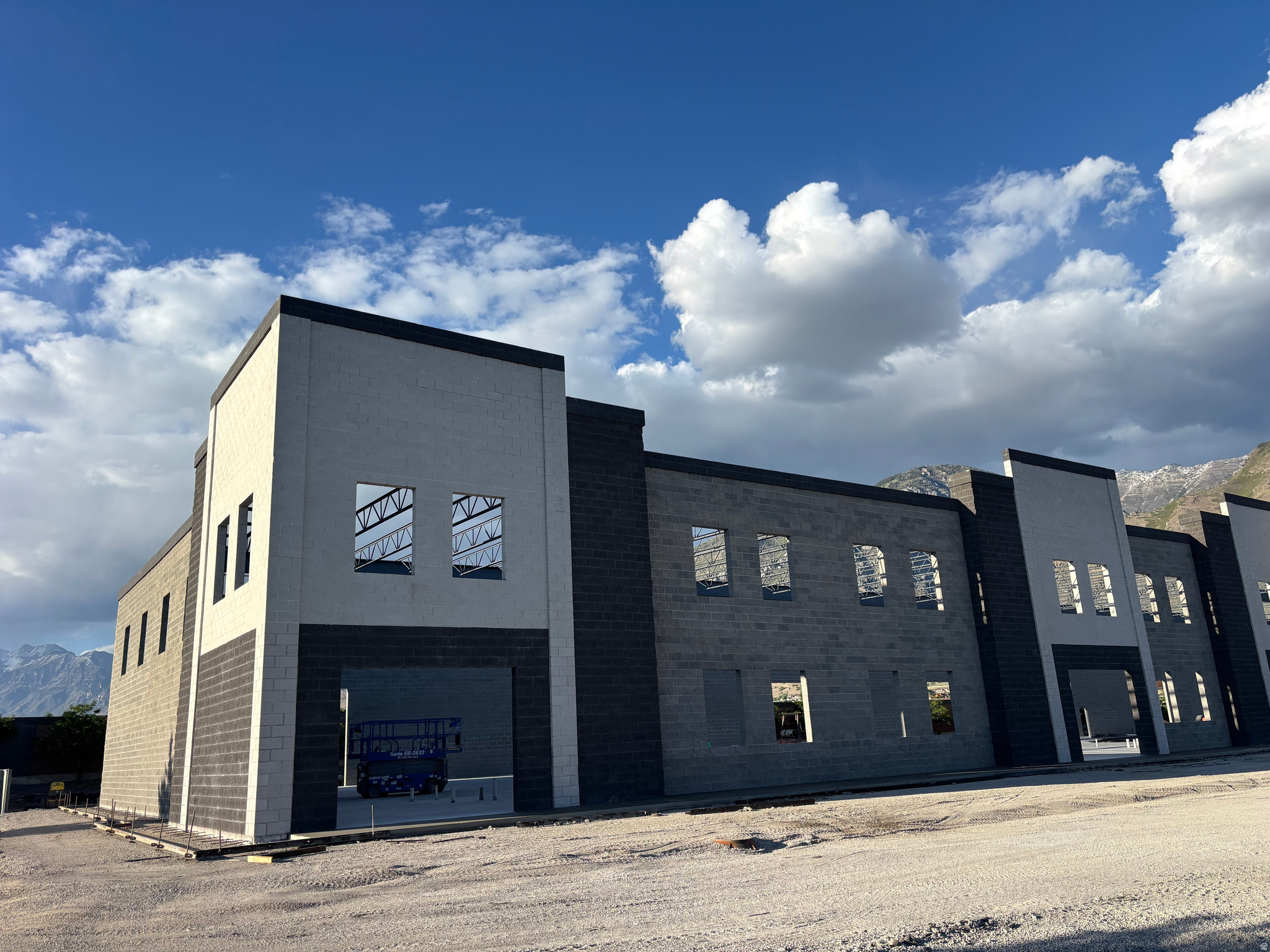 Nine industrial units for lease, ranging from 4,600 to 5,200 square feet, that can be combined for even larger spaces. New construction finishing August of 2026, this block industrial building is in a prime location. Overhead doors located in the back give this a retail look from the street for your customers and clients. Seconds away from I-15, and minutes from downtown Provo, this is the ideal location for your business. 24 foot clear height in the warehouse leaves plenty of room. Three phase power. The office area is approximately 1,200 square foot, efficiently designed with a lower floor and upstairs offices and break room. Heated warehouse and heated/air conditioned office space. This awesome location will lease up fast.  Square footage figures are provided as a courtesy estimate only and were obtained from architect.  Buyer is advised to obtain an independent measurement.