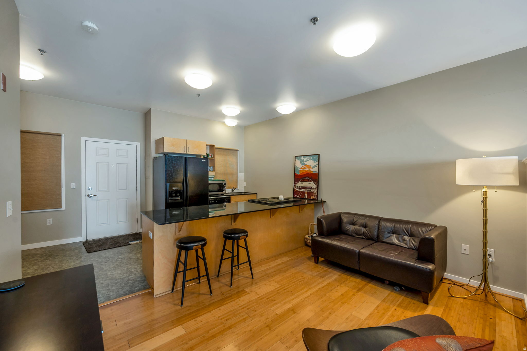 Discover urban living at its best in this stylish studio condo at the Library Square Condominiums, perfectly positioned right on 500 S. and directly across from the former Leonardo building and Salt Lake City Public Library. With downtown energy, Washington Square Park, and some of the city's best restaurants and shopping just steps away, this home puts you in the center of everything.  Inside, you'll find 9foot ceilings, hardwood flooring, and a smart, open layout enhanced by a divider wall that creates a defined bedroom area. The kitchen features granite countertops, a dining peninsula, and plenty of storage - complemented by the condo's generous closet and storage space throughout. A full bathroom and inunit washer and dryer add everyday convenience.  Enjoy fresh air and city views from your private balcony, or head up to the shared rooftop terrace for relaxing, entertaining, or soaking in the skyline.   - Prime downtown location on 500 S   - Directly across from the SLC Library   - Steps from Washington Square Park, dining, and shopping   - 9-foot ceilings & hardwood floors   - Granite countertops & dining peninsula   - Studio layout with bedroom divider wall   - Excellent closet and storage space   - Full bathroom   - Private balcony   - Shared rooftop area   - In-unit washer & dryer  No Parking included with unit, but Wasatch Manor next door has parking spots available for $75 per month.