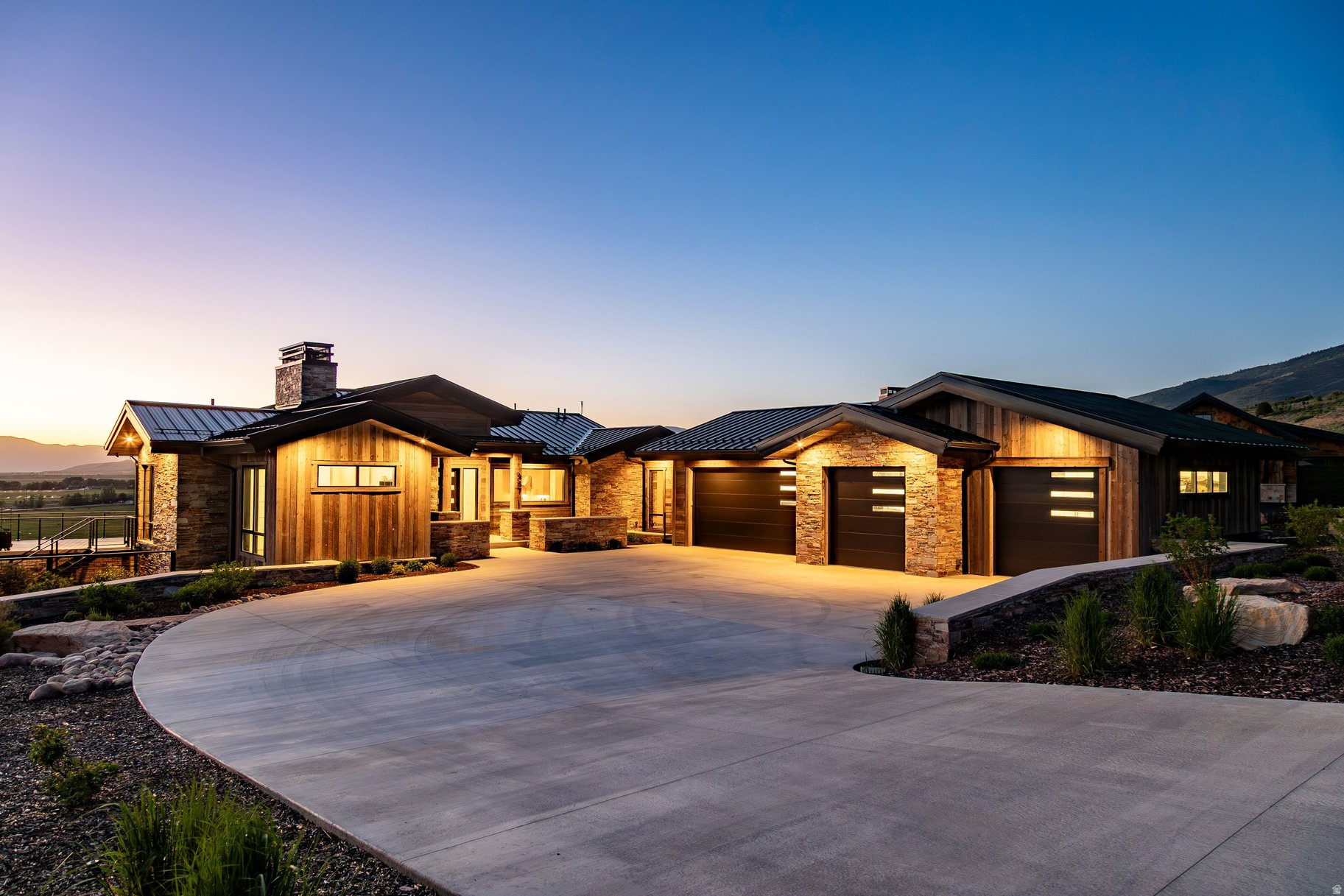 Custom High Star Ranch Home with Dual Primary Suites. Thoughtfully designed for luxury, accessibility, and lock and leave convenience, this custom 2024 home at High Star Ranch offers over 5,100 square feet of beautifully finished living space with sweeping views of Deer Valley Resort, Mount Timpanogos, and the surrounding Wasatch Mountains. Positioned along the community canal, the home is filled with natural light through floor to ceiling windows and sliding glass doors that frame the stunning mountain backdrop. The chef's kitchen offers exceptional storage, custom cabinetry, and a generous walk in pantry, while a spacious main level primary suite and elevator access between levels create effortless everyday living. The walkout lower level functions as an ideal guest retreat or multigenerational living space with a second primary suite, guest bedroom and bath, second kitchen, family room, dining area, dedicated fitness room, and a large flex space with its own exterior entrance. Thoughtfully designed for privacy and flexibility, the lower level comfortably accommodates extended family, long term guests, or a variety of lifestyle needs. Outside, enjoy a privately located saltwater hot tub and beautifully landscaped homesite with fruit trees, berries, vegetables, custom flower planters, multiple decks and covered patios, a fire pit, and a fully fenced backyard with custom metal fencing. Natural Trestlewood, stone, and a metal roof create timeless mountain architecture with exceptional durability and low maintenance ownership, while integrated smart home technology provides true lock and leave convenience and peace of mind whether at home or away. Residents enjoy High Star Ranch's extensive trail system, equestrian amenities, clubhouse, fitness center, pool, hot tub, pickleball courts, and abundant open space, all just minutes from Park City and approximately 45 minutes from Salt Lake City International Airport.