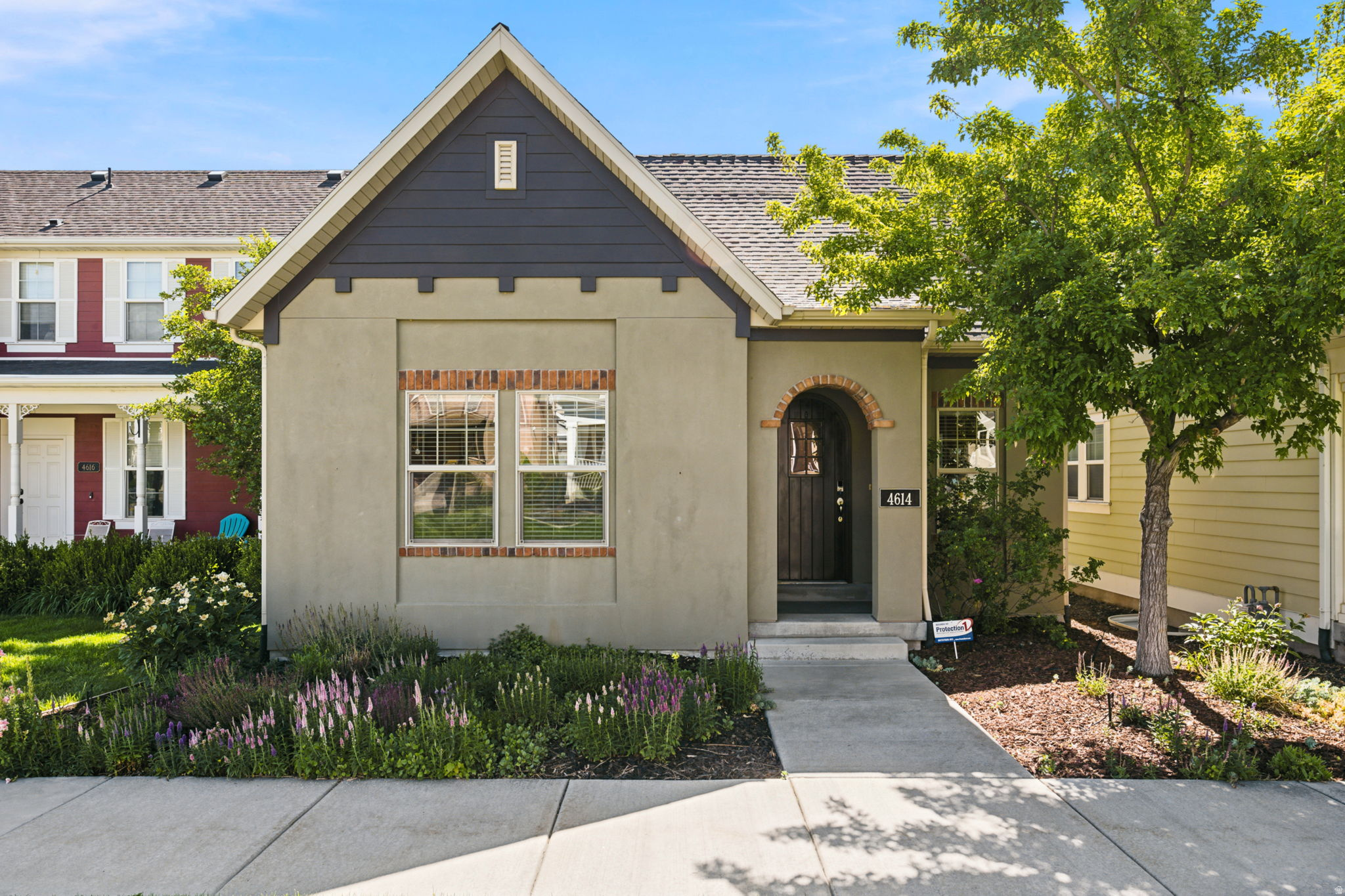 Style, comfort, and meticulous care come together beautifully in this impeccably maintained Daybreak rambler. Thoughtfully designed for everyday living and entertaining, the home features soaring 10-foot ceilings, hardwood floors, abundant natural light, and a spacious open-concept layout. The upgraded kitchen offers custom cabinetry, granite countertops, and generous gathering space. The main level includes a private primary suite, a second bedroom, and full bath, while the fully finished basement provides additional living space, two bedrooms, and a versatile office or den. Recent updates include a new water heater, dishwasher, sprinkler heads, rebuilt backflow system, and newer AC. Enjoy summer evenings on the Trex deck in the fully fenced yard, all just minutes from Daybreak's parks, trails, shopping, dining, and schools.