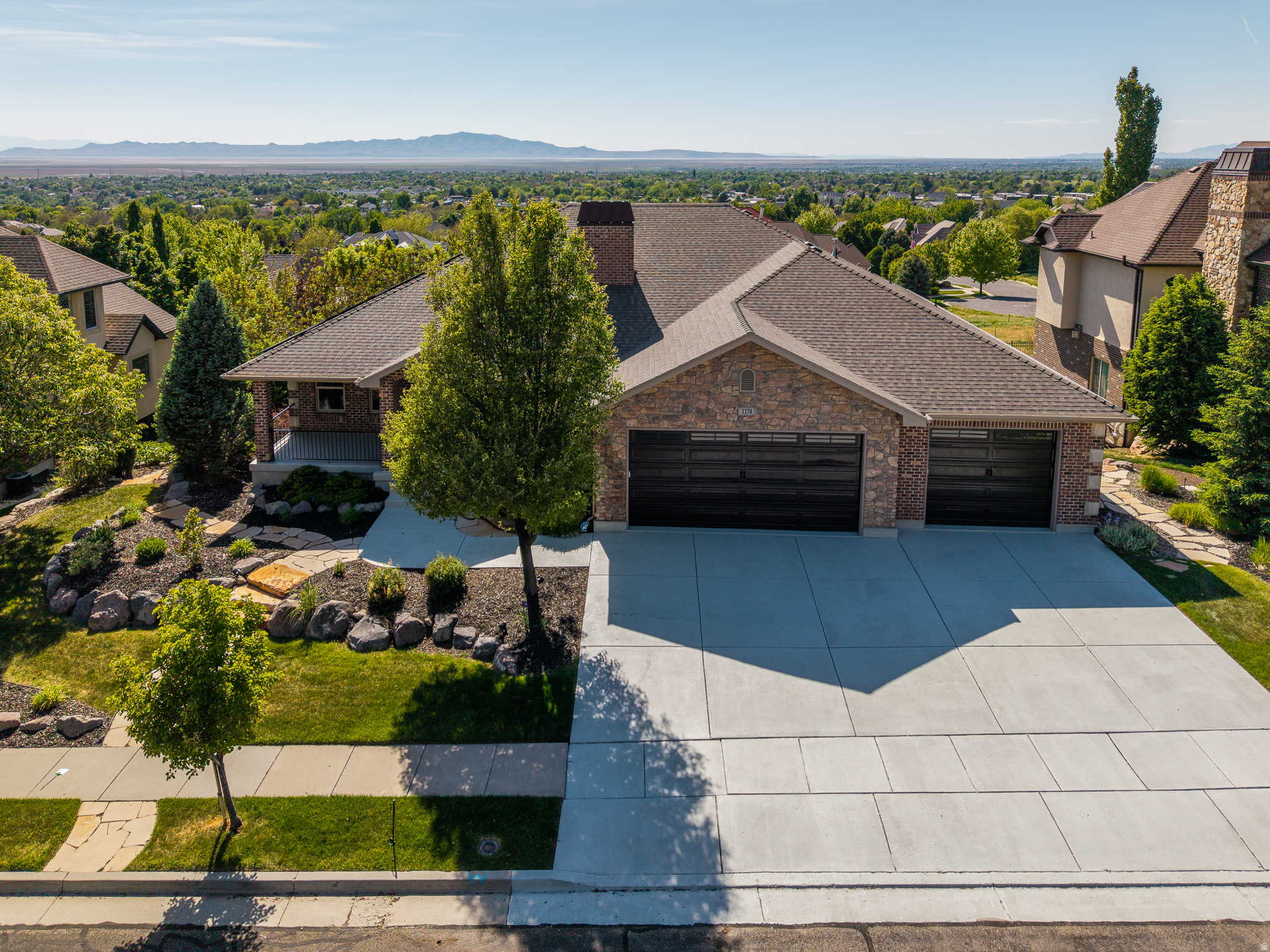 **OPEN HOUSE SAT (6/13) 11 AM - 1 PM**BEST VALUE IN FRUIT HEIGHTS** Who wants unobstructed views of the valley! Perched within the coveted Hidden Springs community, this exceptional residence captures truly unobstructed 360-degree mountain and valley views, offering a rare blend of refined luxury and everyday serenity. Thoughtfully positioned to embrace its breathtaking surroundings, the home invites seamless indoor-outdoor living with both a covered upper deck and expansive lower patio designed for sunset evenings and year-round entertaining. A welcoming entry introduces a beautifully appointed private office with its own direct access to the rear deck-an inspiring retreat for work, creativity, or quiet moments overlooking the landscape. The heart of the home unfolds into a light-filled great room where soaring vaulted ceilings, custom built-ins, and panoramic windows frame the surrounding scenery from nearly every angle. The open-concept kitchen and living spaces are designed for effortless gatherings, featuring a generous center island, granite countertops, beautifully white cabinetry, and a thoughtfully integrated pantry. The main-level primary suite offers a peaceful sanctuary with sweeping views and a spa-inspired bath complete with a soaking tub, separate shower, and elevated finishes that create a true retreat experience. Convenience meets functionality with laundry rooms located on both levels of the home. Downstairs, the fully finished lower level offers exceptional flexibility for entertaining and extended living. A spacious family room with kitchenette is complemented by an additional office or craft room featuring extensive wall-to-wall built-ins. Three additional bedrooms and two bathrooms provide comfortable accommodations for family and guests alike. Recent upgrades include a newly installed heating and cooling system along with a fully integrated solar system, combining modern efficiency with long-term sustainability. Outside, meticulously manicured landscaping enhances the home's striking curb appeal and tranquil atmosphere. Residents of Hidden Springs enjoy access to one of the area's most admired lifestyle communities, complete with a clubhouse, pool, fitness center, hot tub, and beautifully maintained common spaces. The Beautiful Tree-lined streets and signature neighborhood water feature create a welcoming sense of arrival. Just moments from the foothills, residents enjoy immediate access to hiking and mountain biking trails, while remaining conveniently located near shopping, dining, freeway access, Station Park, Salt Lake City International Airport, and Snowbasin Resort. Opportunities to own a view property in Hidden Springs are exceptionally limited-and highly sought after.
