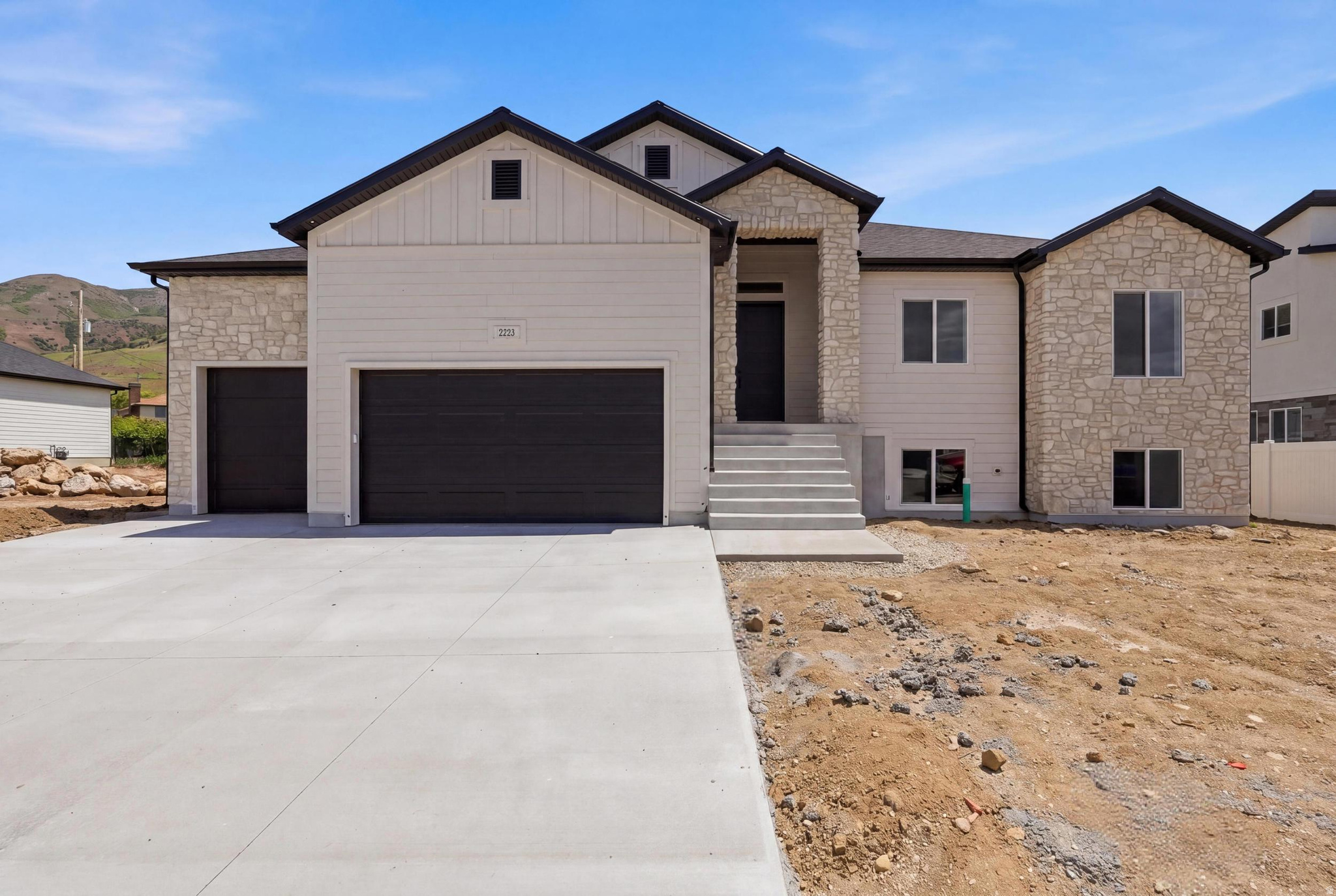 Stunning modern transitional rambler located on the east bench of Perry with breathtaking mountain and valley views. Built by a builder known for exceptional craftsmanship and high-end finishes, this home features 3 bedrooms, 2 1/2 bathrooms, a 3-car insulated garage, and an unfinished walkout basement with room to grow. The grand 12-foot entry and Great Room ceilings give it an open, inviting layout. Enjoy Beautiful custom LVP flooring, accent walls, iron stair railing, custom tile showers with Euro glass, Bosch appliances, a large island, Level 6 quartz countertops with mitered edges, and an incredible lighting package. The luxurious primary suite includes a soaker tub and large custom closet. Additional upgrades include a covered deck, tankless water heater with recirculator, 5 Ft. Linear Fireplace, 96% efficiency furnace, MyQ insulated garage doors, custom pantry shelving, and beautiful stone, Hardi, and stucco exterior. Seller is offering a $10,000 incentive toward buyer closing costs, subject to lender requirements. A rare combination of luxury, quality, and peaceful bench living.