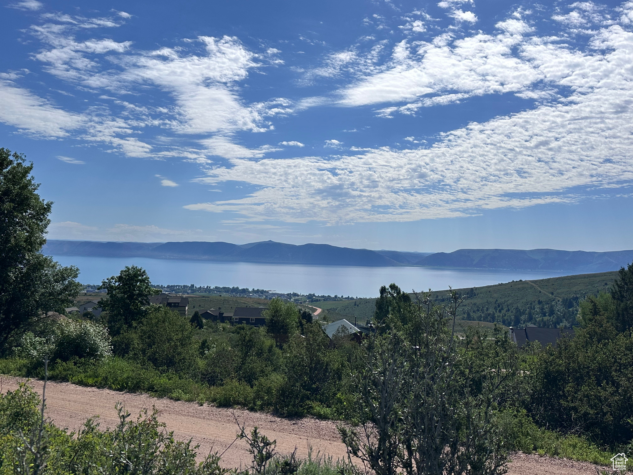 Rare opportunity to own an .91 acre lot in the sought-after Bridgerland HOA at Bear Lake! Enjoy amazing lake and mountain views with plenty of space to build a cabin, vacation retreat, or year-round home. Easy access to endless outdoor recreation including ATV trails, snowmobiling, hiking, boating, and fishing. Peaceful setting with year round access. The $2,000 HOA building fee has been paid!
