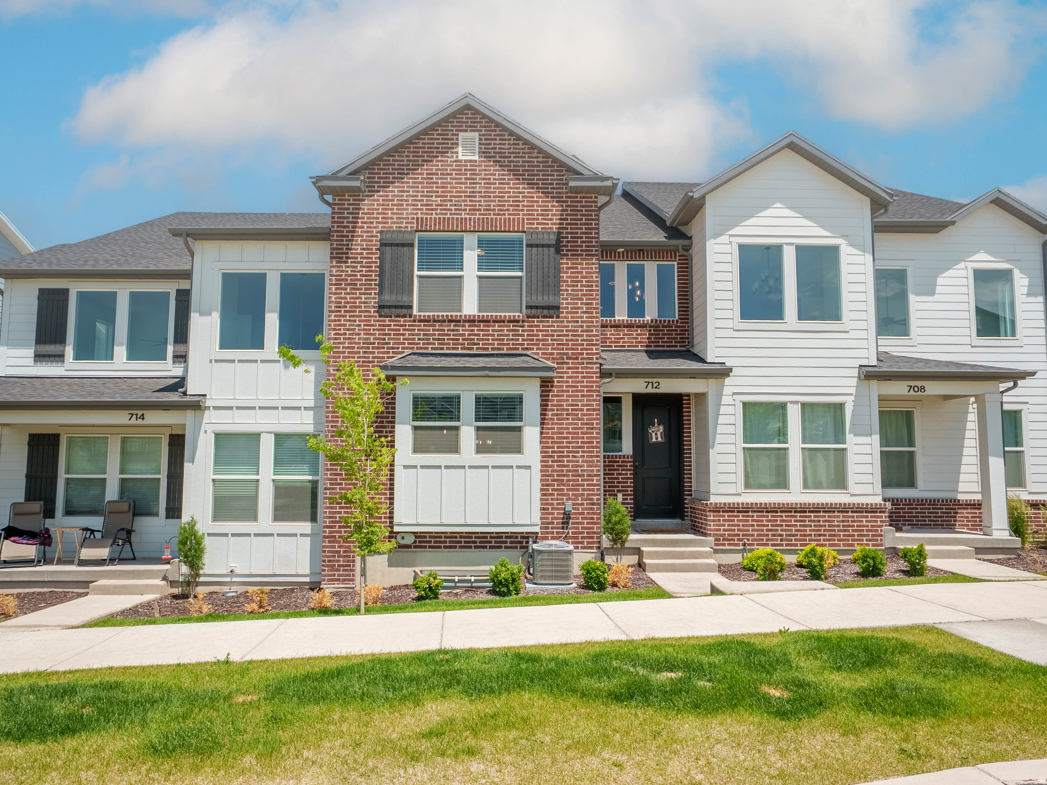 Amazing nearly new townhome in the fast growing community of High Ridge built by Edge Homes.  Dont wait for a home that is being built.  This home has all the finishes you already want.  Upgraded LVP flooring, custom chosen neutral paint, upgraded quartz countertops, custom chosen painted cabinets with black hardware, 20 foot high ceilings in family room, custom chosen master bath with double sinks, upgraded glass shower enclosure and metal railing with wood cap.  Room to grow in the unfinished basement to add a 4th bedroom, family room and full bathroom. Pickle ball courts directly across the street and plenty of extra guest parking in front of the home, behind the home and at the clubhouse.  Pool and clubhouse are located just around the corner. Amazing mountain and valley views from the back of the home.