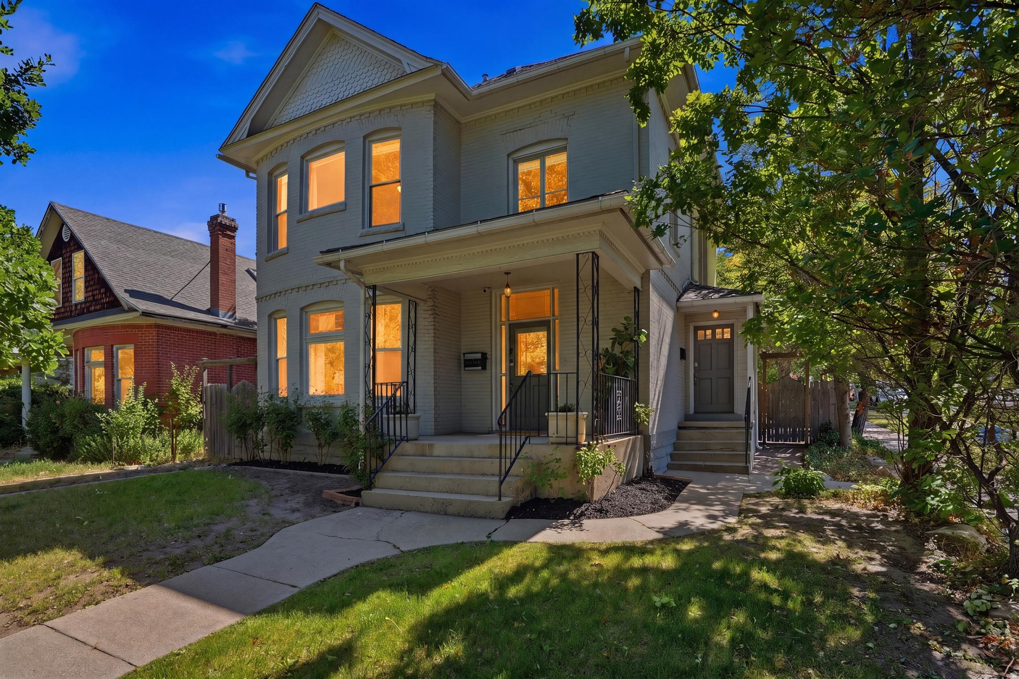 Rare opportunity in the heart of Salt Lake City's highly sought-after 9th & 9th neighborhood. Just steps from beloved local favorites, Liberty Park, shopping, dining, and everyday conveniences, this historic Victorian offers an exceptional blend of character, flexibility, and investment potential. Originally built in 1911, the home showcases timeless architectural details including soaring ceilings, hardwood floors, original trim work, stained glass accents, exposed brick, and period lighting. Thoughtfully maintained and updated over the years, major improvements include a new sewer line, tankless water heater, updated wiring, new A/C, stainless steel appliances, and more. Grandfathered as a single-family residence while functioning as a true up/down duplex, the property features separate entrances, utilities, and meters. The upper level offers a private 2-bedroom, 1-bath residence, while the main residence includes spacious living areas, multiple bedrooms, and additional finished basement space. Whether you're seeking owner-occupied income potential, a multi-generational living arrangement, a live/work setup, or an investment property in one of Salt Lake City's most desirable neighborhoods, this home offers remarkable versatility. Historic charm, modern updates, and an unbeatable location combine to create a truly unique opportunity in the center of 9th & 9th. Square footage figures are provided as a courtesy estimate only and were obtained from County Records.  Buyer is advised to obtain an independent measurement.