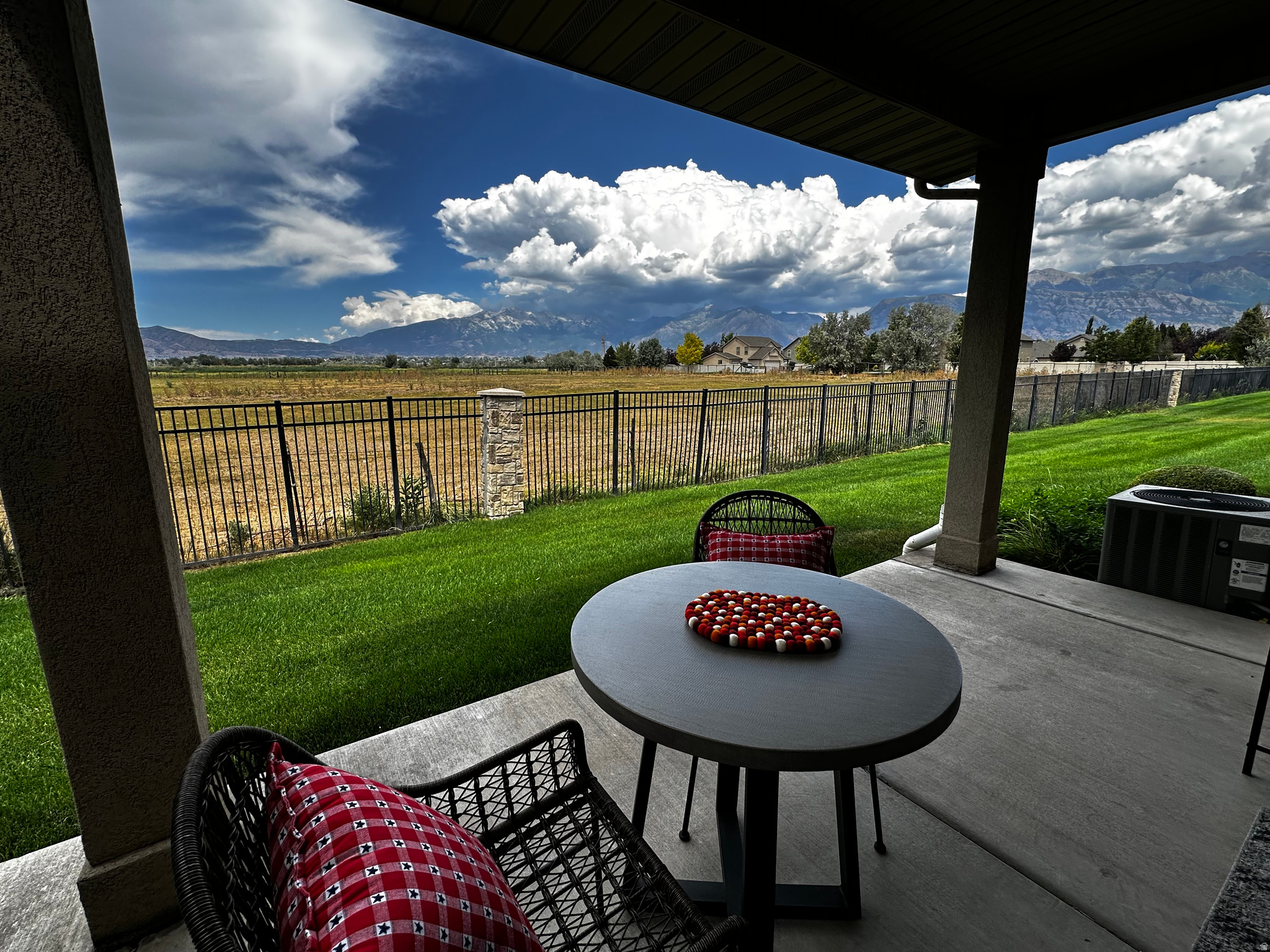 WELCOME HOME - Townhome living without the townhome feel! This beautifully maintained end-unit offers the privacy, natural light, and spaciousness of a single-family home while providing the convenience of low-maintenance living. Located in a desirable private community just minutes from Silicon Slopes, I-15, shopping, dining, and recreation, the location is ideal for both commuting and enjoying everything Utah County has to offer. The thoughtfully designed floor plan features soaring ceilings, expansive windows, and an open-concept great room filled with natural light from every direction. The end-unit location provides additional windows throughout the home, creating a bright and inviting atmosphere rarely found in townhome living. Enjoy breathtaking mountain and valley views from the covered backyard patio-an ideal space for relaxing, entertaining, or simply enjoying Utah's beautiful sunsets. The spacious kitchen opens seamlessly to the dining and living areas, making gatherings easy and comfortable. Recent improvements include fresh interior paint, quality carpet, and updated flooring completed within the last two years. All carpet is in like-new condition. The home also features newer kitchen appliances and a newer water softener that is included with the property. Upstairs you'll find a spacious primary suite with walk-in closet and remodeled bathroom featuring a walk-in shower, plus two additional bedrooms and a full bath. The oversized two-car garage provides excellent storage space. This is a rare opportunity to enjoy the convenience of townhome living with the space, privacy, views, and natural light typically associated with a single-family home.