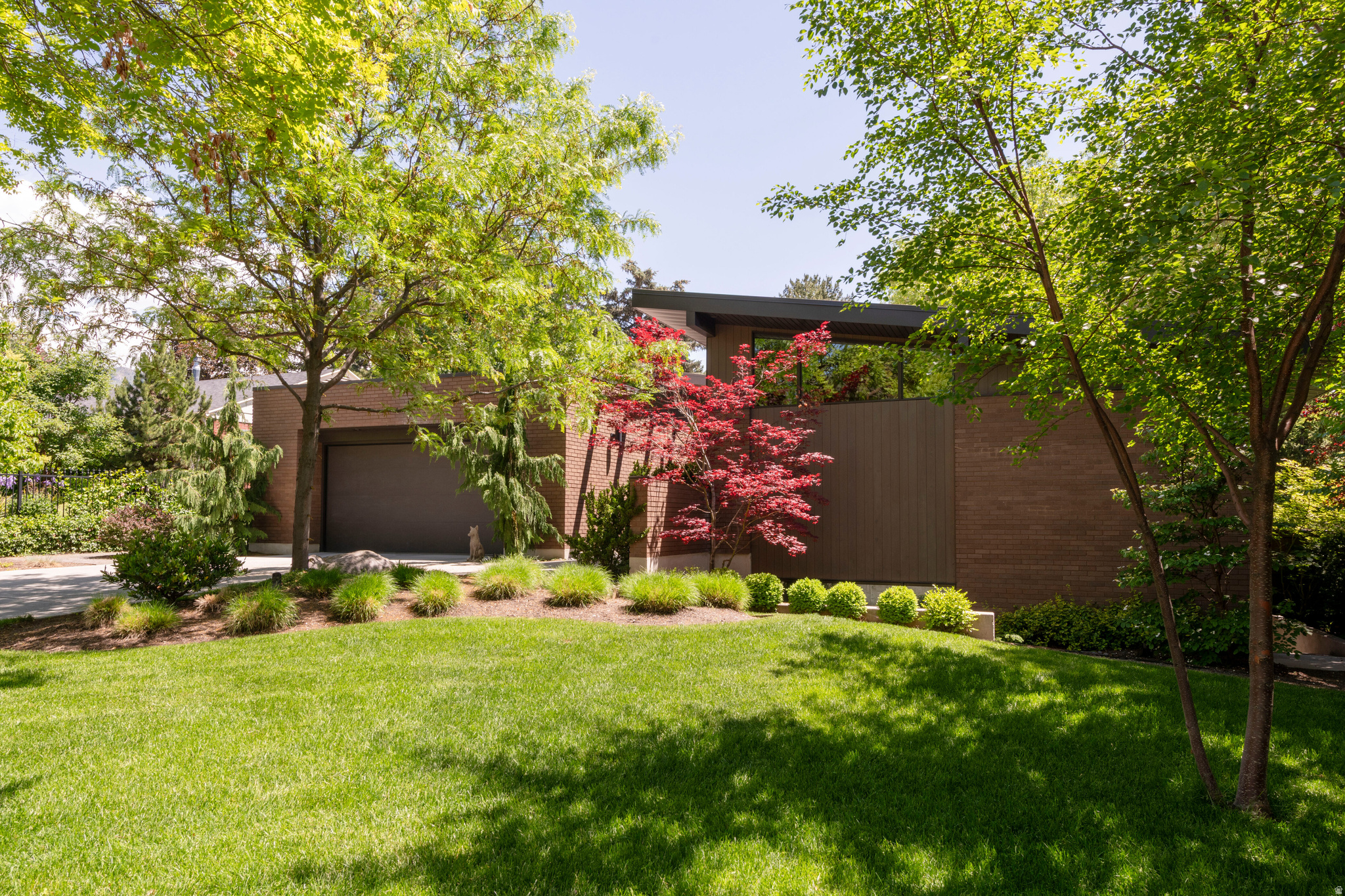 This Mid Century Modern house sits on a large park like lot, situated near the east bench of Salt Lake and not far from the Salt Lake Country Club. This home brings the outside in as soon as you walk thru the door. Loads of natural light throughout this open floor plan. Vaulted ceilings, white oak hardwood floors and custom windows. Wonderful kitchen, great for entertaining or enjoying a small family dinner. Professional appliances and expansive eating bar. Main floor primary suite has it's own private patio, newly remodeled bath and large walk in closet. Main floor living at it's finest.  The entire house has been freshly painted (exc. one room) and newly carpeted. Enjoy your time, day and night, in this incredible yard, a well kept secret. When not sitting on the patio enjoying the views, play tennis on a privately shared court (6 surrounding  houses). There is no end to the possibilities for this yard, pool, ADU, just to name a few, or just leave it like it sits, a park of quiet and privacy. All of this and a very large storage area. Owner/Agent. Shown by appt only. No sign on property.