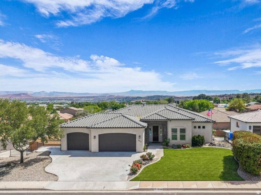 Built by a contractor as his personal residence, this exceptionally well-crafted home showcases quality construction with 2x6 framing and 5/8-inch drywall throughout, offering durability and comfort rarely found today. Nestled in a quiet, peaceful neighborhood with no HOA, the property enjoys beautiful city and mountain views while still being conveniently close to everything in town. Impeccably maintained and filled with beautiful quality finishes, the home features a spacious open floor plan flooded with natural light and anchored by a cozy fireplace in the living room. Enjoy seamless indoor and outdoor living with a covered deck upstairs and a large, covered patio below, creating the perfect spaces for relaxing or entertaining year-round. The walk-out basement includes a fully equipped 2-bedroom, 1-bath apartment complete with its own kitchen and laundry room, ideal for guests, multi-generational living, or rental income potential. Additional highlights include a dedicated food storage room with a 330-gallon water storage system for added preparedness and convenience. Car enthusiasts, hobbyists, or craftsmen will appreciate the incredible lower-level workshop garage, fully enclosed in concrete and equipped with heating, air plumbing, and multiple 240V outlets. Outside, the thoughtfully designed backyard offers a gardening area along with a fun sandbox play space featuring a climbing wall and slide from the upper patio, making this home as functional as it is inviting. Basement apartment refrigerator is excluded. Buyer to verify all information, deemed reliable, however buyer to verify all info including utilities, rental restrictions, and HOA information if applicable.