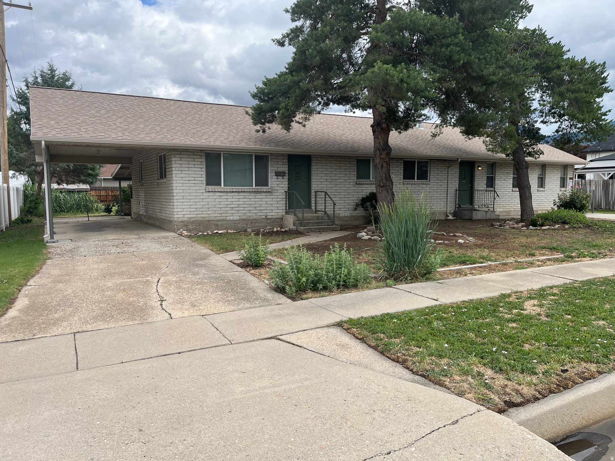 Turnkey duplex in the heart of Spanish Fork situated on a spacious 0.45-acre lot! This side-by-side duplex features separate addresses (144 & 148 N 400 E), individual utility meters, and fully independent living spaces, making it an excellent investment opportunity.  The property includes a 2-bedroom, 1-bath unit (approximately 830 sq. ft.) and a 4-bedroom, 1-bath unit (approximately 1,130 sq. ft.), offering flexibility for rental income, owner occupancy, or multigenerational living.  A standout feature is the large 1,500 sq. ft. shop located at the rear of the property. Rent out the duplex for steady income while utilizing the shop for storage, hobbies, a workshop, or additional business needs.  Conveniently located near shopping, restaurants, parks, schools, and freeway access, this unique property combines income potential, versatility, and an unbeatable location.  Square footage figures are provided as a courtesy estimate only and were obtained from County records.  Buyer is advised to obtain an independent measurement.