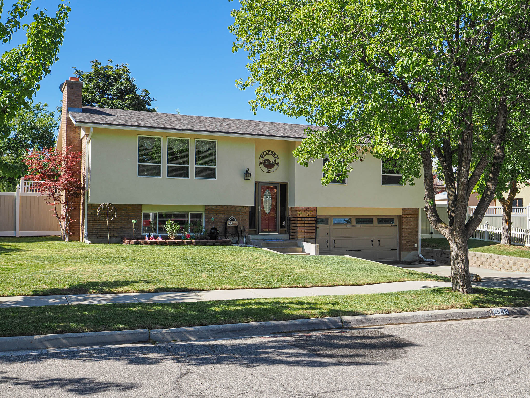 Spacious Family Home Just Steps from the Cottonwood Heights Recreation Center!  This well-maintained home offers the perfect combination of comfort, versatility, and location. Featuring two updated kitchens, two beautifully remodeled bathrooms, and a private primary suite with an ensuite bath, there's plenty of space for family living and entertaining.  The former garage has been thoughtfully converted into a studio ADU, creating excellent potential for rental income, guest accommodations, a home office, or multi-generational living. For even greater flexibility, the space could be expanded into the basement with the addition of a doorway at the bottom of the stairs. Two separate laundry hookups provide added convenience and functionality.  Step outside to enjoy a private backyard retreat complete with a large deck, two spacious storage sheds, and mature trees that offer shade and privacy-perfect for relaxing or entertaining.  Ideally located within walking distance of three highly regarded schools and the Cottonwood Heights Recreation Center, this home also provides easy access to shopping, freeways, and world-class ski resorts. Whether you're seeking extra living space, income-producing potential, or room for extended family, this property offers exceptional value and endless possibilities.  Easy to show-schedule your private tour today!