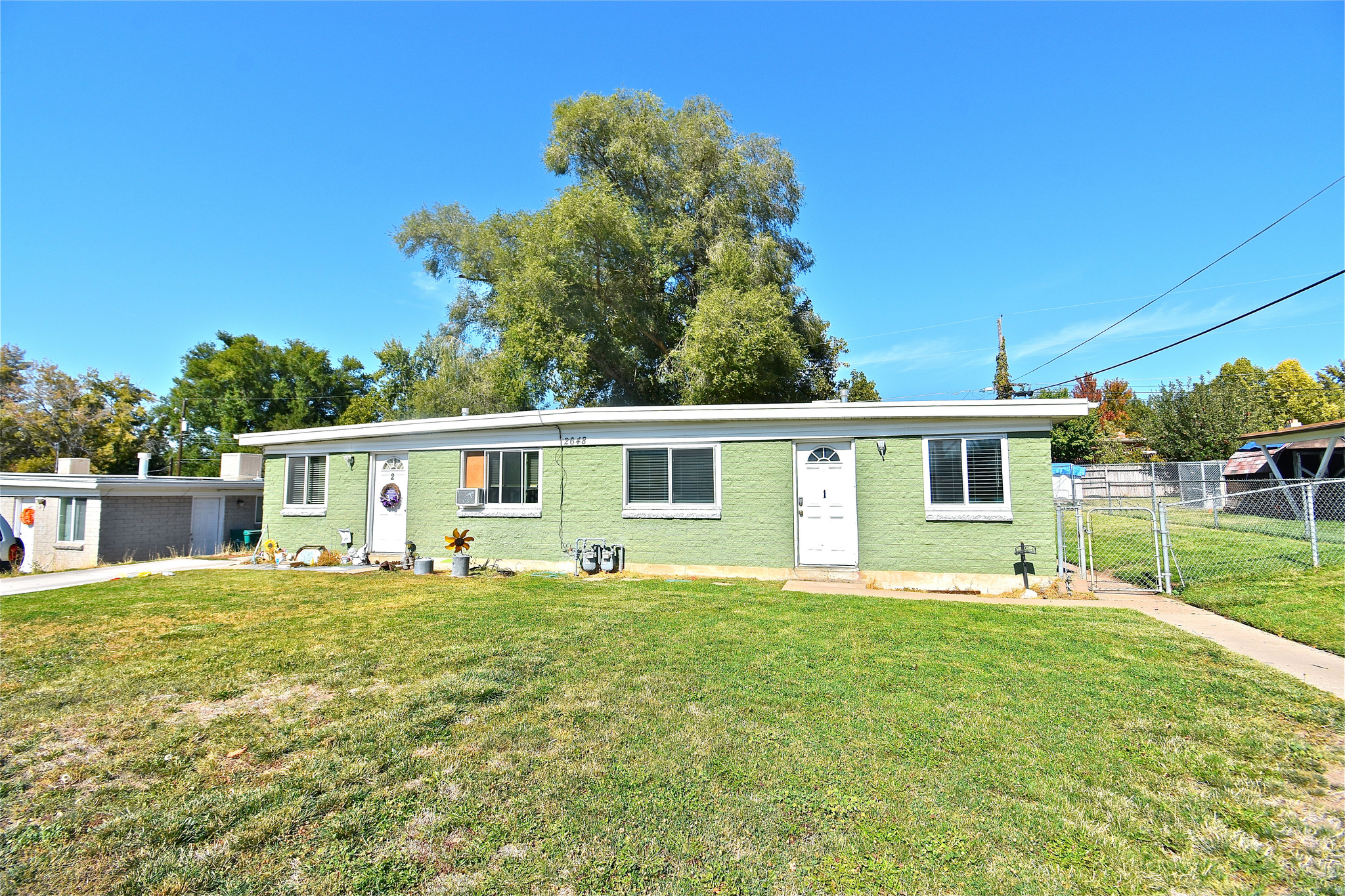Please do not disturb tenants. Call for an appointment to see this great investment opportunity in Roy! This side-by-side brick duplex features two 2-bedroom, 1-bath units, each approximately 900 sq ft. Both units have been updated by the seller and are currently leased with long-term tenants in place. Each unit includes a small storage unit, and the property offers a 2-car carport in the back. Located on a 0.19-acre lot. Solid income-producing property and a great addition to any rental portfolio. Buyer to verify all information. Please schedule an appointment. 24-hour notice required to show. Please do not disturb tenants.
