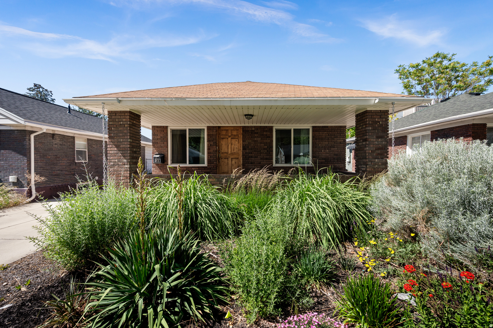 Charming renovated brick bungalow on a beautiful street in an incredibly convenient location. This home blends timeless character with distinctive custom touches. Inside, you'll discover rare Brazilian hardwood floors, striking concrete countertops, and handcrafted hickory cabinetry that create a warm, elevated feel throughout the home. Thoughtful renovations and major system updates provide both style and peace of mind. Recent improvements include a new water heater (2026), new electrical breaker box and electrical updates (2023), sewer main repair (2023), replaced concrete driveway (2022), and water main replacement (2021). A newer one-car garage with the newer concrete driveway and driveway gate add convenience and curb appeal. Outside, enjoy a beautifully xeriscaped front yard for low-maintenance living, while the backyard offers raised garden planter boxes ready for your favorite flowers, herbs, or vegetables. Perfectly positioned between downtown SLC and Sugar House, this home offers unbeatable accessibility. Enjoy walking distance to local favorites including Pho Tay Ho and Penny Ann's Caf and Grove Market. Just minutes to downtown Salt Lake City, Sugar House, Trax train stations and with easy access to I-15 and I-80 Freeways. This home blends timeless character with distinctive custom finishes you simply won't find in this price range. A truly special property filled with personality, quality craftsmanship, and thoughtful updates!  Square footage figures are provided as a courtesy estimate only.  Buyer is advised to obtain an independent measurement.