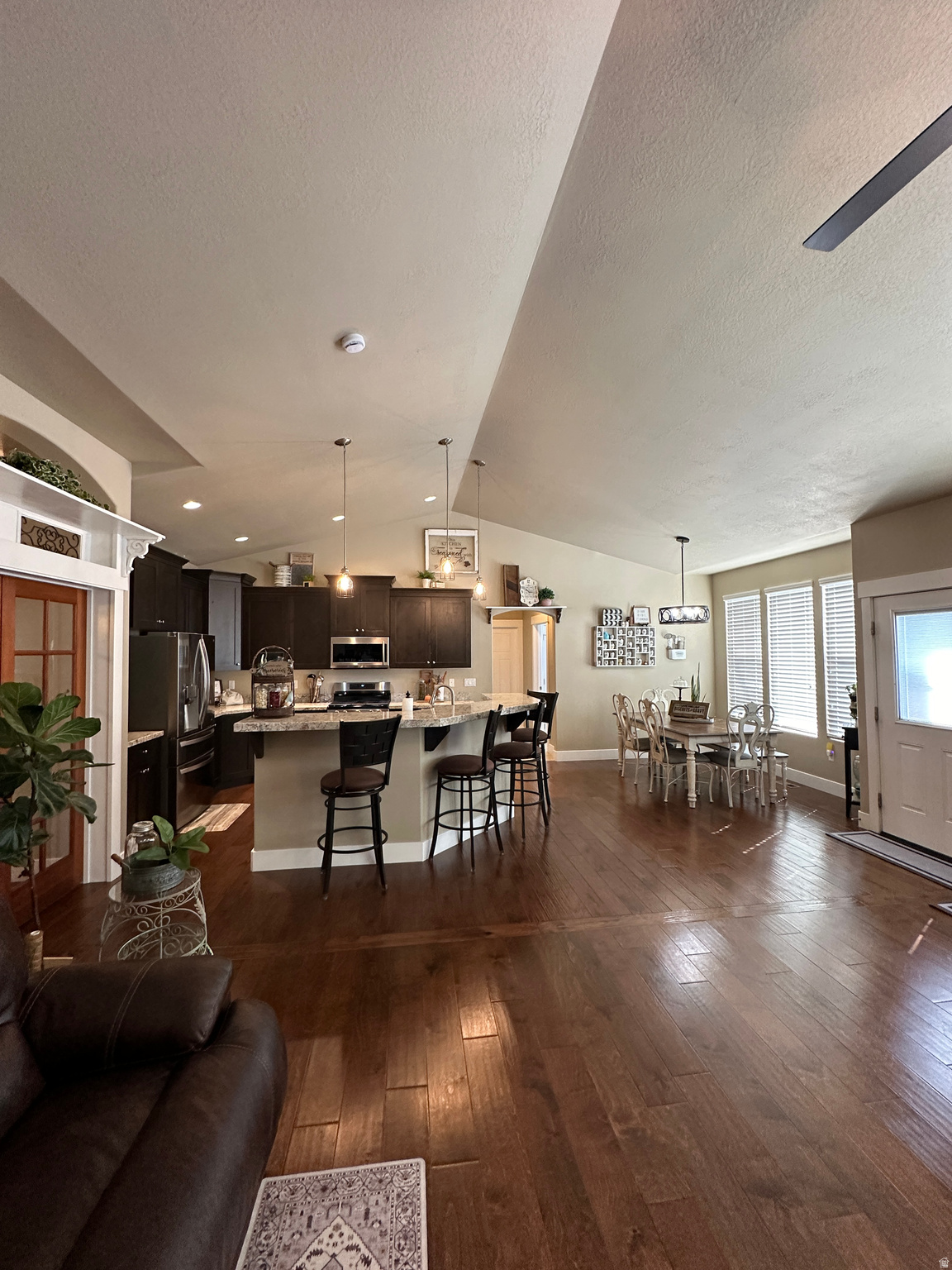 Exceptional value on this Beautiful Custom Rambler in the Loma Vista Subdivision w/large lot, open floor plan, vaulted ceilings, new gas range, beautiful kitchen with granite countertops, raised bar island, ascent walls, gas fireplace, two primary bedrooms with a backyard full of lush plants, vibrant flowers, trees, etc. offering the perfect retreat.
