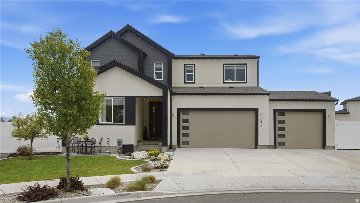 Free 1-0 RATE BUY DOWN! Rate 1% lower for first 12 months. Though preferred lender, qualified buyers. Call for details. Multi Generational Living Options! Conveniently located minutes from Bangerter Highway and 20 minutes to Salt Lake international Airport.  This stunning home combines thoughtful design and functionality throughout. The custom kitchen showcases premium full length cabinets, pantry, gas range, wall oven and microwave. The main level offers a versatile bedroom or flex space with a full bath, perfect for guests, office, or multi-generational living. Upstairs you'll find a spacious primary suite with ensuite, two additional bedrooms and a loft area with potential for future bedroom. The finished basement expands your living options with a kitchenette (another great option for multi generational living!) two bedrooms, a full bathroom, and flex space. A large yard designed for enjoyment, featuring multiple patio areas, expansive entertaining space, RV parking, and full-perimeter Govee lighting.  Additional conveniences include a garage utility sink, overhead storage racks, and outdoor shed. Custom top-down/bottom-up window coverings throughout provide both privacy and natural light control, completing this truly move-in-ready home. Square footage figures provided as a courtesy, obtained from county records. Buyer is advised to obtain an independent measurement.