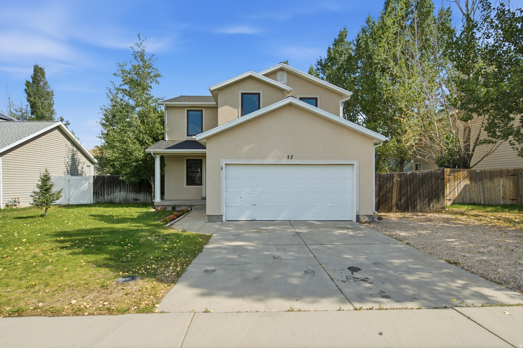 Don't miss this opportunity to own a beautifully refreshed 4-bedroom home in the heart of Heber City! From the moment you walk in, you'll appreciate the bright, open living spaces, fresh interior paint, brand-new flooring throughout the main level, and new carpet upstairs that give the home a clean, modern feel. The spacious, finished basement offers incredible flexibility with room for a family room, home office, gym, or play space. Outside, the fully fenced backyard provides plenty of space for kids, pets, gardening, or your next backyard BBQ, complete with mature raspberry bushes that produce fresh berries each season. Conveniently located just minutes from schools, parks, shopping, and everything Heber Valley has to offer, this move-in-ready home delivers the perfect combination of comfort, space, and value.