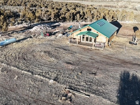 A true outdoor retreat, the property is rich in wildlife and offers exceptional hunting and fishing opportunities.  The property features two fully equipped cabins, each with all utilities in place and serviced by septic systems. Additional improvements include multiple propane tanks, multiple wells, and convenient access via a recently improved road along the north boundary. The land borders both tribal land and Browns Draw, offering added privacy and scenic surroundings. Agricultural infrastructure is well established with two pivots, multiple sections of Pod K-Line, and wheel-line irrigation. Water rights are excellent, including 178 shares of Monarch and two (2) shares of Dry Gulch K2. A large shop site is already in place, complete with a cement pad and ready for construction of your new shop. Square footage figures are provided as a courtesy estimate only and were obtained from County . Buyer is advised to obtain an independent measurement.