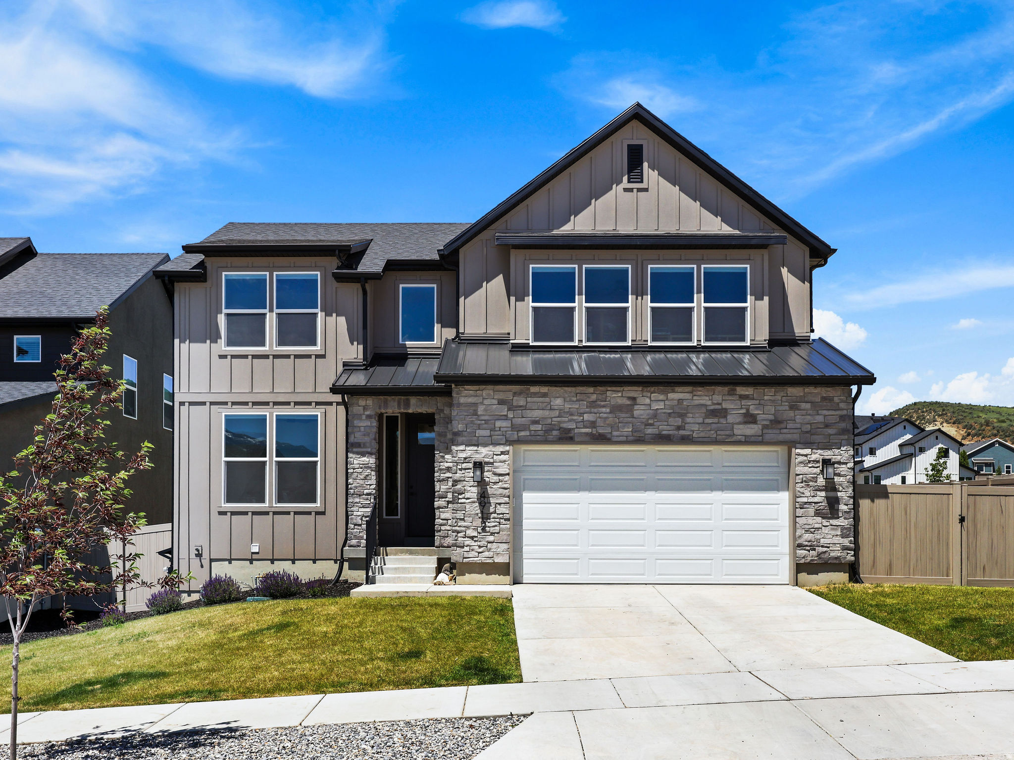 Experience elevated mountain living in this exceptional custom-built residence offering 7 bedrooms and 7.5 bathrooms, with short-term rental approval providing both lifestyle and investment opportunities. Thoughtfully upgraded throughout, the home showcases textured granite countertops, custom cabinetry, designer fixtures, under-cabinet lighting, automatic stair lighting, durable LVP flooring, a separate basement entrance, top-down/bottom-up blinds, and oversized doors and windows that flood the interior with natural light while framing breathtaking mountain views-just to name a few. Perfectly positioned just 14 minutes from Snowbasin, this home places world-class skiing, hiking, biking, and year-round recreation at your doorstep. Wake up to spectacular mountain views and enjoy the tranquility of a community renowned for its natural beauty, top-rated schools, and welcoming atmosphere. Offering the perfect blend of luxury, comfort, and convenience, this remarkable property is a rare opportunity to own an extraordinary home.   Square footage figures are provided as a courtesy estimate only, buyer is advised to obtain an independent measurement.