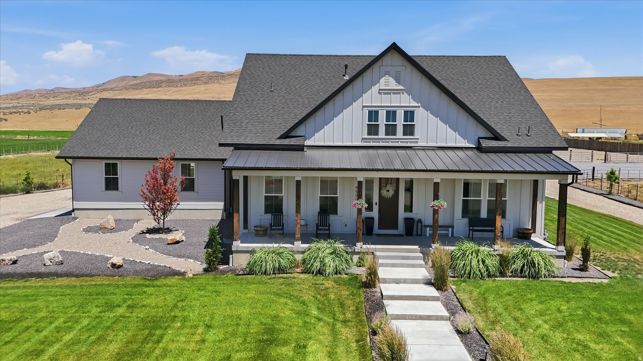 Remarkable custom-built estate situated on just over 5 acres in the peaceful country community of Bothwell! Properties of this caliber rarely come available, and this one is truly move-in ready. Designed with both luxury living and country lifestyle in mind, this exceptional property is a dream come true for equestrian enthusiasts, hobby farmers, and those seeking room to live, play, and entertain. Inside you'll find a spacious open-concept floor plan featuring a stunning rock fireplace, quartz countertops throughout, high-end kitchen appliances including a gas range and double ovens, a large downstairs laundry room with custom cabinetry, dedicated exercise room, Jack-and-Jill bathroom in the basement, water softener, radon mitigation system, and two water heaters. The oversized garage includes an attached mud room with direct access to the backyard patio. Washer, dryer, and refrigerator are included. Step outside and enjoy breathtaking mountain and valley views from the covered front porch or relax on the expansive covered back patio. The property features immaculate landscaping, piped metal fencing, large gravel parking and turnaround areas, automatic sprinklers connected to secondary water, dragline irrigation for pastures, an in-ground trampoline, and a brand new custom storage shed with decorative front porch is negotiable. Equestrian amenities are second to none and include two fenced horse pastures with water spigots, 3 shares of Bear River Canal irrigation water, a 36' x 36' all-steel horse barn with an additional 12' overhang, power and water, three horse stalls with attached pens, tack room, and a 115' x 185' sand riding arena. The recreation opportunities continue with a fully fenced full-size sports court perfect for basketball, pickleball, and more, along with a turf whiffle ball field for endless family fun. This is a rare opportunity to own a turn-key country estate offering the perfect blend of luxury, recreation, and equestrian living. Be sure to view the 3D tour and video tour for the complete experience. Showings available to qualified buyers only. Buyer to verify all information.