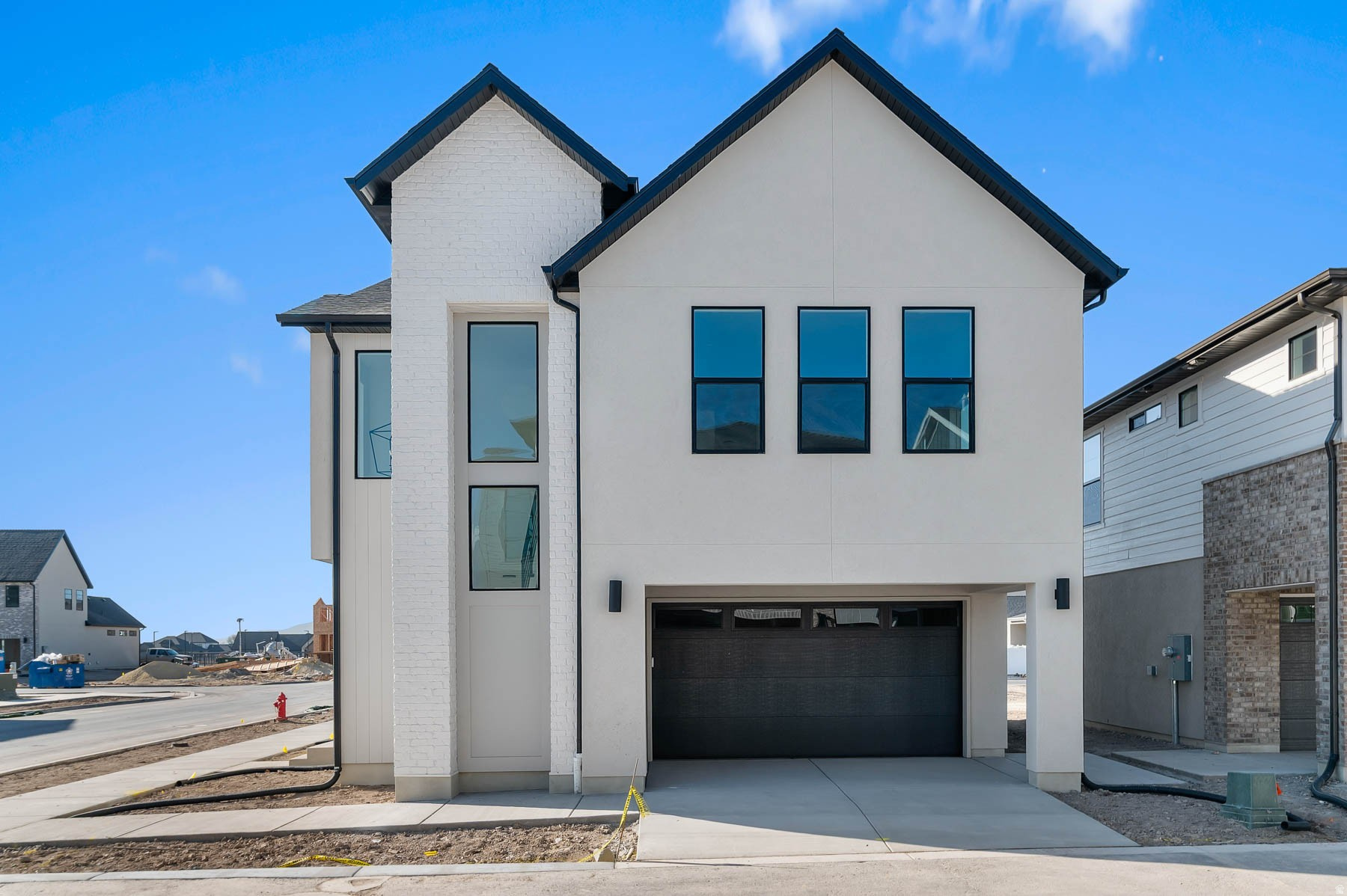Come see this beautiful brand new Keystone Scandia home in a great Provo community with great views of the lake! This home features a modern kitchen with gray laminate cabinets and quartz countertops, paired with stainless steel gas appliances. Durable laminate hardwood, vinyl tile, and carpet flooring throughout. The home offers can lighting, a tankless water heater, and energy-efficient options for modern comfort and savings. Stylish metal railing accents the stairway, complemented by craftsman base and casing. The owner's bathroom includes elegant quartz surrounds, finished with sleek black matte hardware for a contemporary touch. Comes fully landscaped with localscaping to save time & money!