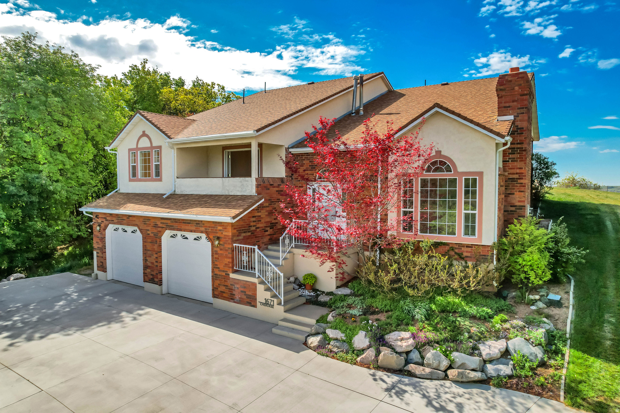 Situated on a quiet cul-de-sac in Shadow Valley, this custom-built 4-bedroom home offers stunning views! views! views! of the mountains from the front and back.  It is perched on a 1.2-acre lot with no backyard neighbors obstructing your views.  It features a new, HEATED driveway.   Inside, you will find a functional layout that offers flexibility for a variety of living needs.  The upper floor has two bedrooms with en-suite bathrooms, which could be used as two primary suites.  The primary bedroom also has a private covered deck.  The middle floor has 2 more bedrooms and a full bathroom.  The spacious kitchen features a large island, lots of natural light, and even a dumbwaiter from the basement for your groceries!   The huge 51' x 21' unfinished basement (with 20' ceilings) has plumbing stubbed for another bathroom.  It could be used for more bedrooms, a home theater, a golf room, etc.   There is also a huge 325 SF storage room in the basement that is not included in the square footage.  Conveniently located just minutes from outdoor recreation, WSU, Hill AFB, and Hwy 89, this property combines open space, scenic views, and versatile living in one of Ogden's most desirable bench locations.