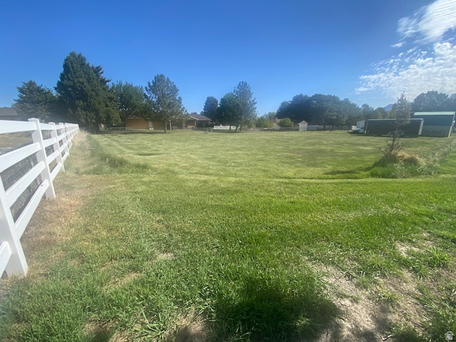 This rare and beautiful residential 1/2 acre horse property is located in an amazing established West Jordan neighborhood.  This property is surrounded by gorgeous tall trees, and is private and secluded.  It has an outstanding view of our beautiful Wasatch mountains with quiet surroundings, yet very easy access to great shopping, restaurants, schools and a quick commute to nearly anywhere in the valley.  Please schedule your visit with showing time as a courtesy to the Sellers.  Come and see it today!!