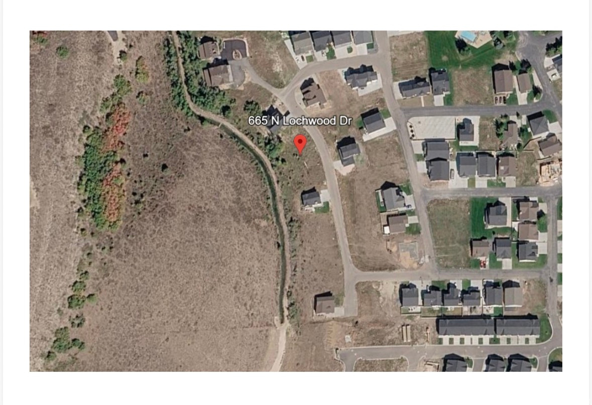 Located in the Lochwood Subdivision in Garden City, this Bear Lake building lot offers an excellent opportunity to build in one of the area's most desirable communities. Positioned on the upper row of the development, the property features scenic views of Bear Lake and is well suited for a vacation retreat or investment property. Short-term rentals are permitted, providing strong rental potential. Amenities include a clubhouse with fitness room and game area, outdoor pool, hot tub, and playground. The property is conveniently located just minutes from the expanded Bear Lake State Park Marina, Garden City bike paths, grocery and hardware stores, restaurants, and local shopping. Utilities are stubbed, and paved roads provide reliable year-round access.