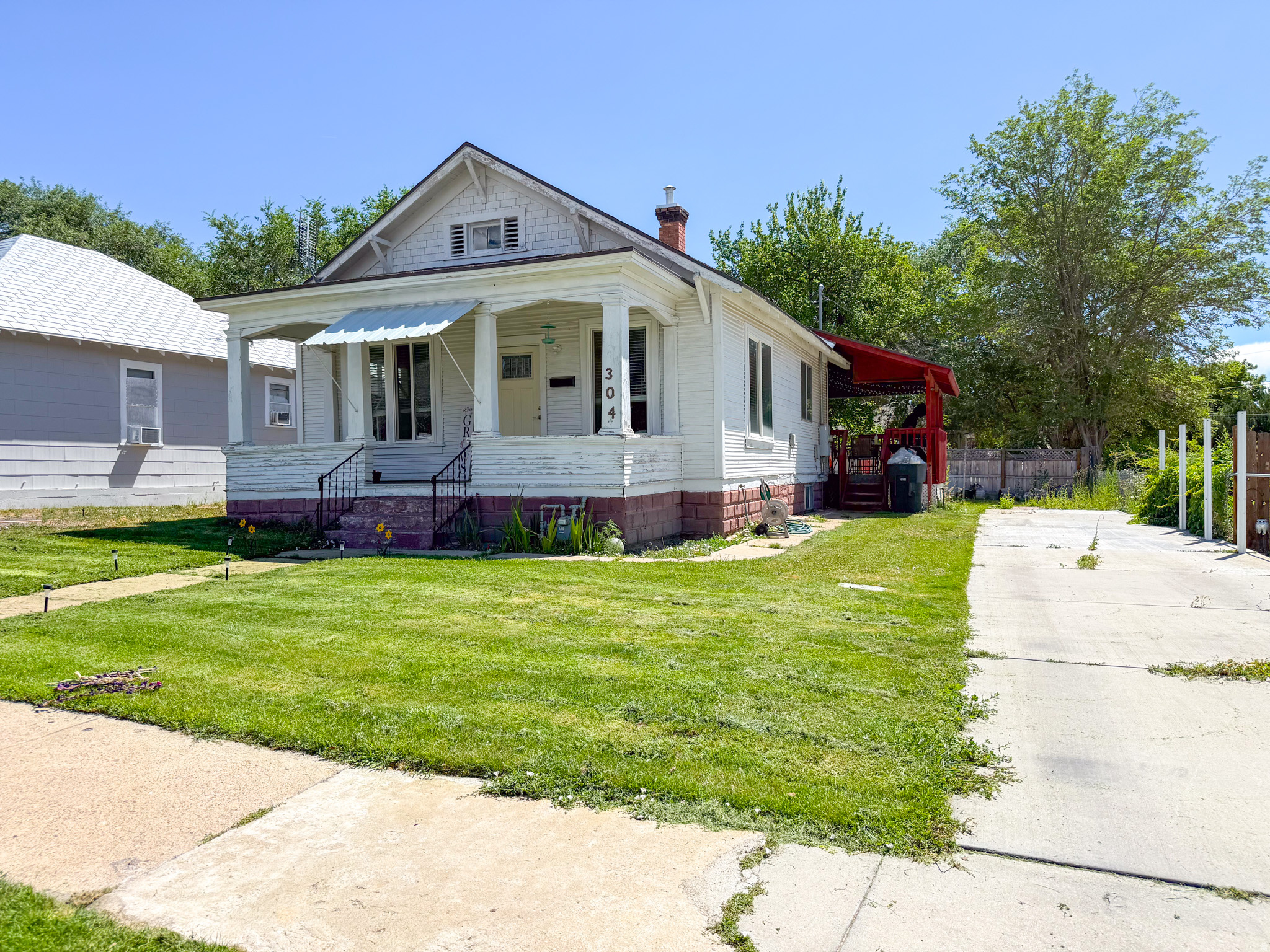 This charming, updated home offers outstanding curb appeal, highlighted by an inviting covered front porch and a spacious, covered deck on the side - ideal for relaxing or entertaining. Extensive improvements in 2021 include new plumbing, along with new electrical-all installed by licensed professionals. The laundry and range hookups are designed for either gas or electric appliances, providing added flexibility. The home's original character has been thoughtfully preserved while incorporating today's most desirable features, including an open-concept layout and modern, neutral paint colors. Move-in ready, this home offers the perfect blend of classic charm and contemporary style. Conveniently located just minutes from the city parks, public swimming pool, and the vibrant downtown district, you'll enjoy easy access to recreation, community events, shopping, and dining. Square footage figures are provided as a courtesy estimate only.  Buyer is advised to obtain an independent measurement.