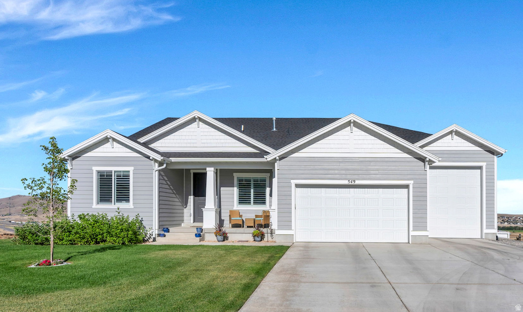 This GORGEOUS 2-year-old Santaquin home (no HOA) has tons of UPGRADES, the VIEWS and the "WOW" factor!!  Tucked away on a quiet cul-de-sac in the south end of Utah County, this beauty sits on nearly 0.40 acres with unobstructed views out the front and the back-because your neighbors should never be the main attraction.  Bring the RV, the toys, the trailer, or finally build that dream workshop. The oversized THIRD-CAR RV GARAGE has the EXTRA HEIGHT AND LENGTH (14 X 38)  you've been searching for.  Inside, the home is every bit as impressive. The STUNNING kitchen features QUARTZ countertops, DOUBLE OVENS, and plenty of room for everything from holiday feasts to late-night cookie baking. Cozy up by the FIREPLACE, enjoy the benefits of a WATER SOFTENER and let the SMART HOME do the heavy lifting with app- and Alexa-controlled POWER SHADES. (Yes, you can open the blinds without leaving the couch.).  The unfinished basement-with its own exterior entrance-is a blank canvas ready for your vision. Home theater? Guest suite? Game room? Home gym? Income potential? You decide.   The spacious, grassy backyard has room for soccer games, backyard barbecues, a trampoline, and all the memories that come with them.  Homes with this combination of nearly new construction, no HOA, premium upgrades, RV parking, smart technology, unbeatable views, and room to grow are RARE!. The only thing missing... is YOU!  Just don't be surprised if your guests suddenly forget it's time to go home!