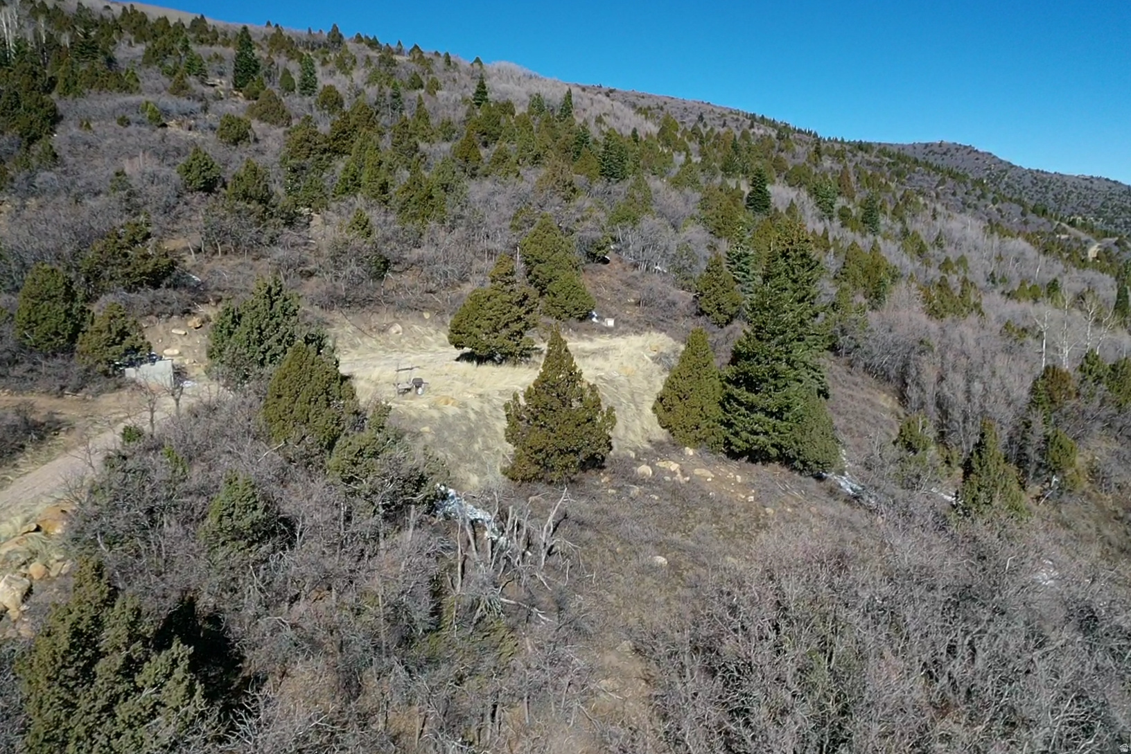 5-acre lot in the 3200 Subdivision, ideally located just minutes from Brian Head, Cedar Breaks, and I-15. This property is ready to build with a prepared building pad, installed septic system, and water tank already in place. Surrounded by Aspen and Pine trees, the lot offers a private setting with natural beauty. The subdivision provides access to a water fill station, with power typically provided by solar and propane delivery available in the area. A rare opportunity to own a build-ready mountain property with essential improvements already completed.