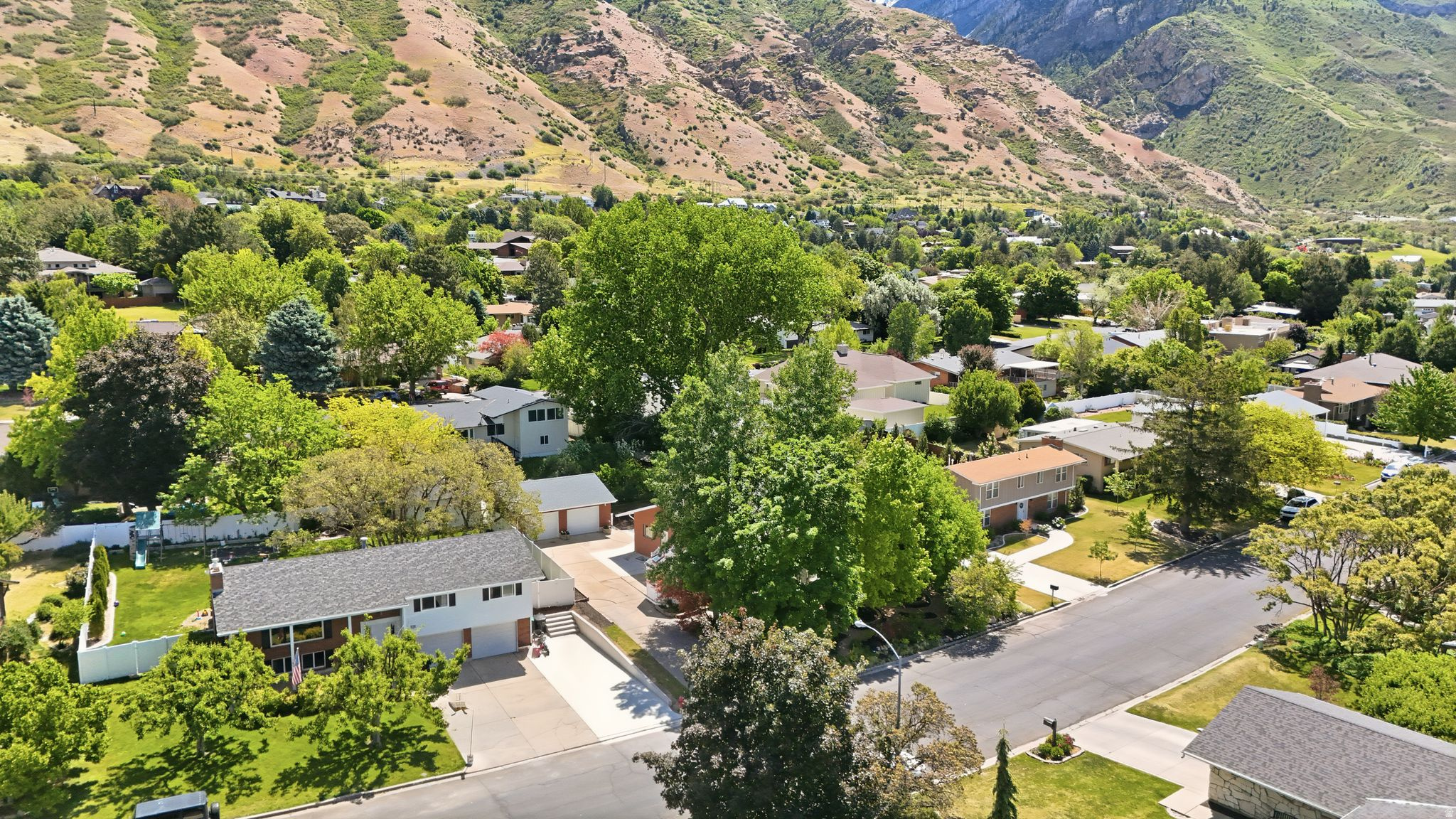 This spacious 3280 sq ft rambler offers 5 bedrooms, 3 bathrooms, and an unbeatable location just minutes from the BYU football stadium in Indian Hills. You'll love the over- sized family room, perfect for hosting, relaxing, or entertaining. The backyard offers privacy and is your own "Farmers Market", see attached for details.  Out front enjoy the secret garden from your enclosed gazebo.    The home has been lovingly maintained and features a new roof, 2 new furnaces and A/C, new water heater, new water softener and a new BOSH convection stove, double ovens, two new garage doors, and a finished upstairs attic space for a fun Kids' Zone (sq. ft. not incl), Whether you're looking for space to grow, entertain, or simply unwind, this home delivers. Don't miss your chance to own in one of Provo's most desirable neighborhoods.