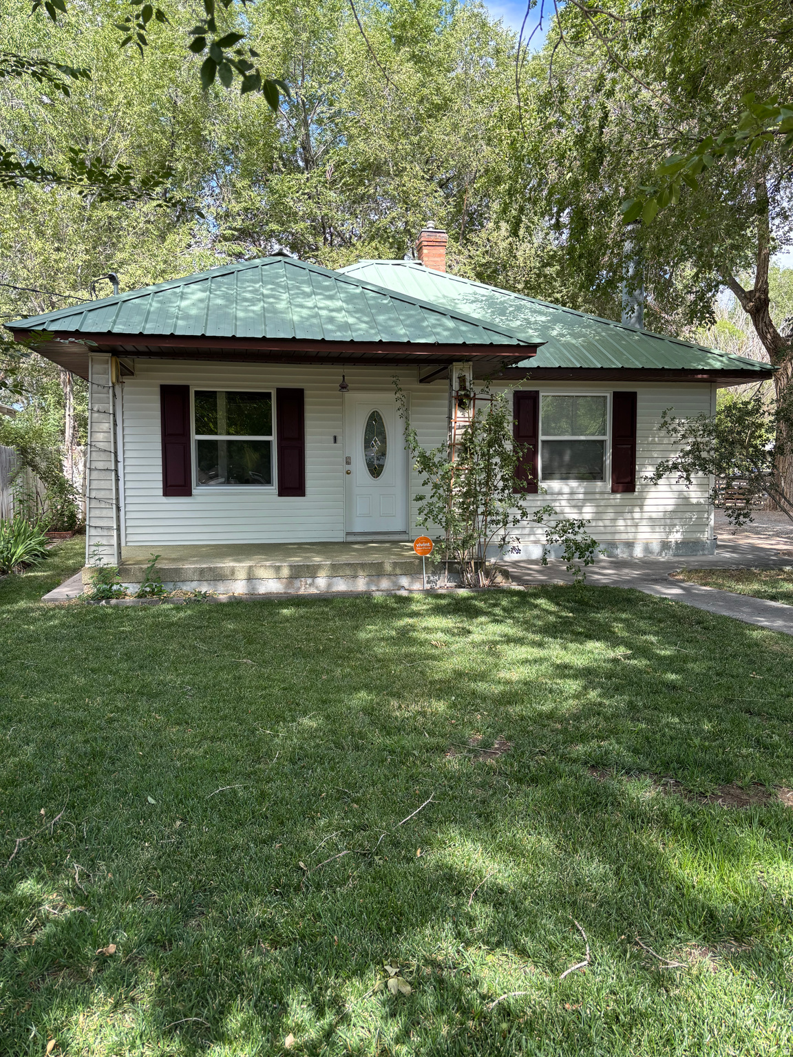 This charming single-level home offers comfortable living with timeless appeal. Relax on the inviting front porch on a quiet morning, then unwind in the beautifully shaded backyard--Perfect for summer BBQs, kids, pets, or simply just relaxing in your own backyard. The detatched garage provides extra storage and workspace, while the deep lot offers the added convenience of rear access from the road behind, giving you plenty of room for RV parking, trailers, toys, or future possibilities. Come see why this is the next place you'll want to call home!  Square footage figures are provided as a courtesy estimate only and were obtained from a recent Appraisal .  Buyer is advised to obtain an independent measurement.