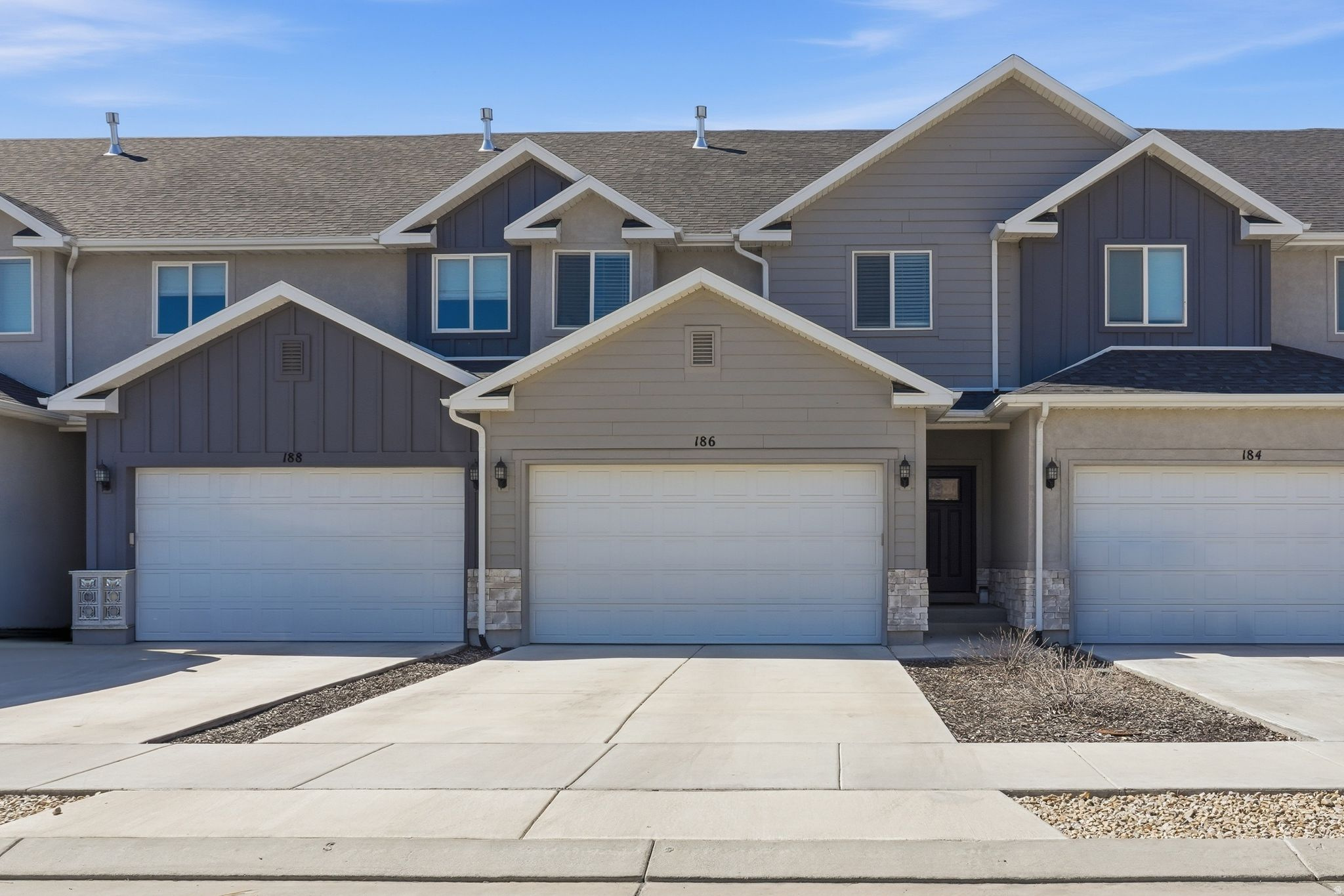 This modern 2,196 sq. ft. townhouse in the Springleaf Townhomes subdivision of American Fork is a must-see. Built in 2021, this beautiful 2-story home offers a spacious and efficient layout with 3 bedrooms and 2.5 bathrooms. The main floor features a comfortable living area, a functional kitchen, and a dining space with high-quality laminate flooring. Upstairs, you will find three bedrooms, including a primary suite. Interior highlights include granite countertops, vaulted ceilings, and double-pane windows for energy efficiency. For your comfort, the home is equipped with central air and forced air heating. Exterior features include a fully fenced yard with an automatic sprinkler system and a 2-car attached garage. Located in the Alpine School District, this property is conveniently situated near Barratt Elementary and American Fork High School. With a low HOA fee of $100/month covering maintenance and snow removal, this move-in-ready home offers the perfect blend of style and convenience. Square footage figures are provided as courtesy estimates only and were obtained from county records. Buyer is advised to obtain an independent measurement.