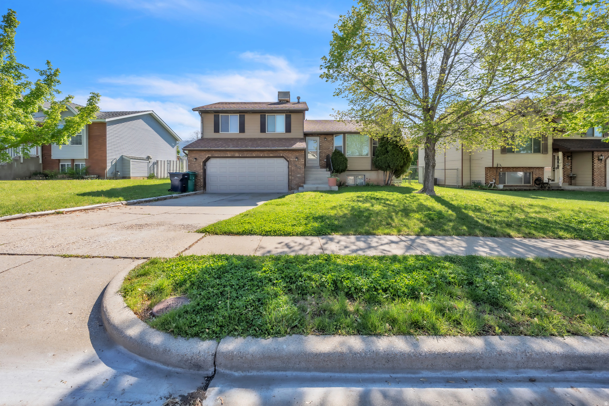 Welcome home to this charming East Layton multi-level home featuring 4 bedrooms, 2 full bathrooms, and 2,008 square feet of comfortable living space. Inside, you'll find an updated kitchen with granite countertops, included appliances, and plenty of room to gather across multiple living areas. The tri-level layout offers flexible space for relaxing, entertaining, or working from home. Step outside to enjoy the large fenced backyard with mature trees, mountain views, an open porch, and a storage shed-perfect for tools, toys, or extra storage. Additional features include central air, gas heat, a 2-car attached garage, secondary water, and a full sprinkler system. All appliances are included, making this home truly move-in ready: washer, dryer, and refrigerator stay with the home. Located in desirable East Layton near schools, parks, shopping, and commuter routes, this home offers the space, updates, yard, and location buyers are looking for. Schedule your private showing today!